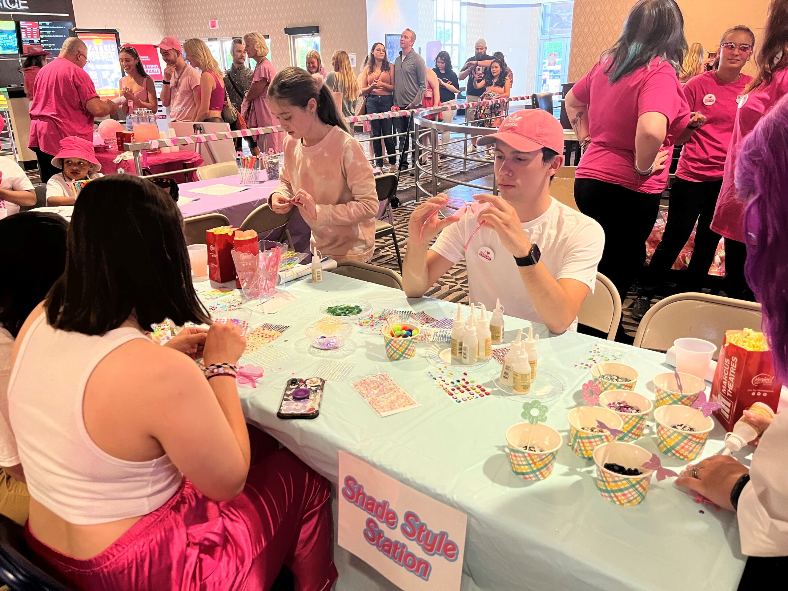 People make crafts at a "Barbie" Blowout party held by Marcus Theatres, with an advanced screening on Wednesday.