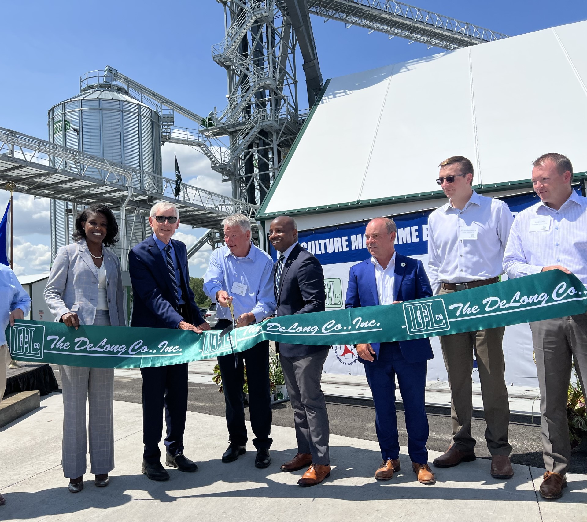 Local, state and federal officials join The DeLong Co. during a ribbon cutting ceremony at a new shipping facility for agricultural products in Port Milwaukee