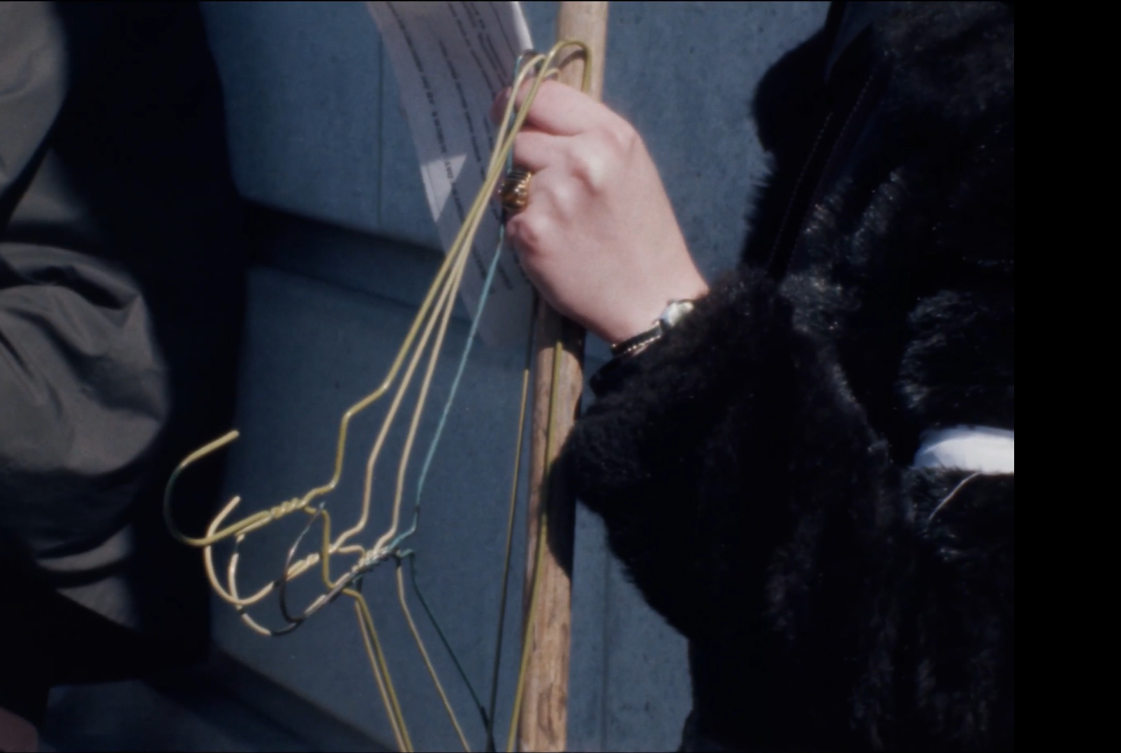 An abortion rights protester holds coat hangers outside the Wisconsin State Capitol in Madison, Wis., to protest a bill to bar people from using Medicaid to fund abortions, on March 8, 1978