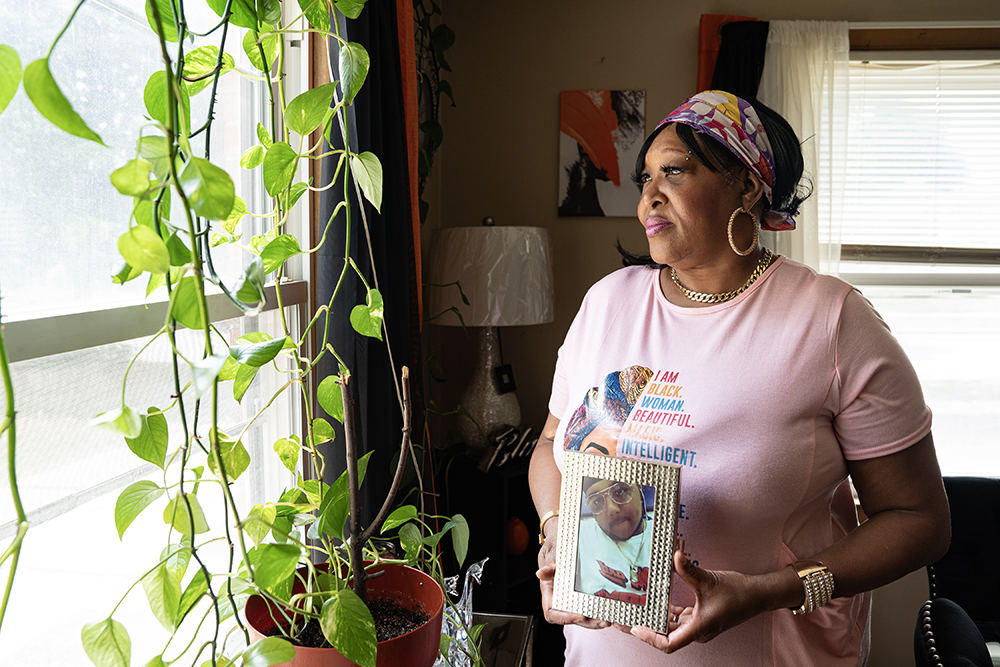 Antoinette Broomfield holds a photo of her late son Le’Quon McCoy