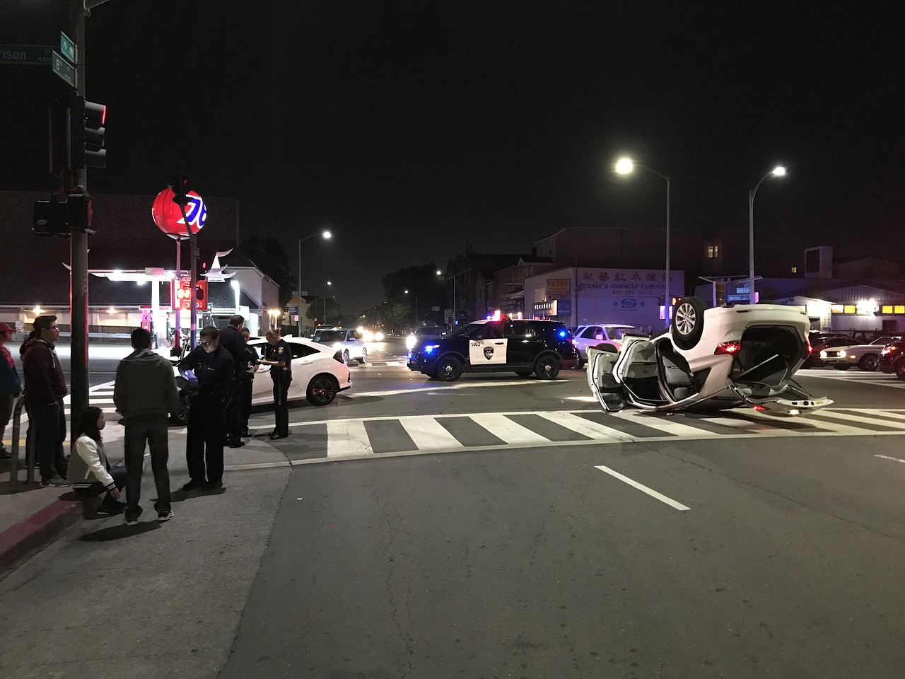 Car accident on city street at night.