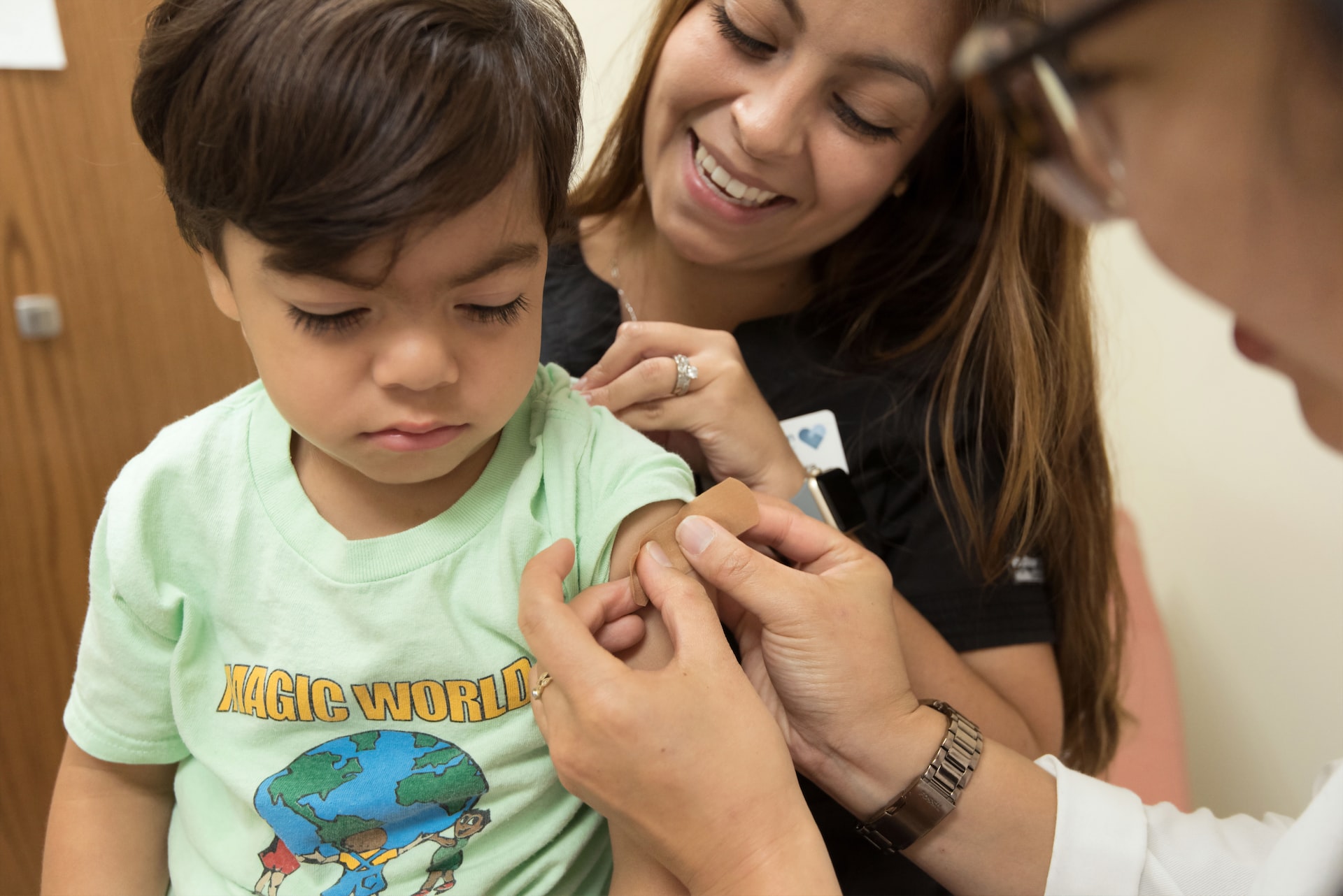 A child getting a vaccine in a doctor's office