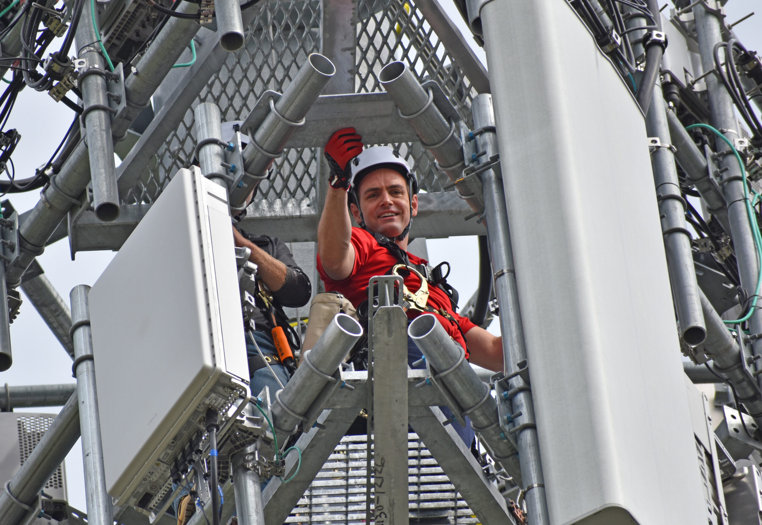 Green Bay Congressman Mike Gallagher looks down from a cell tower in the village of Howard.
