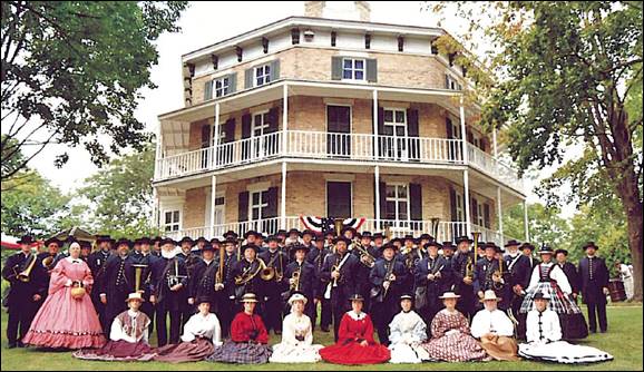 Members of the 1st Brigade Band in front of Watertown's Historic Octagon House Museum.