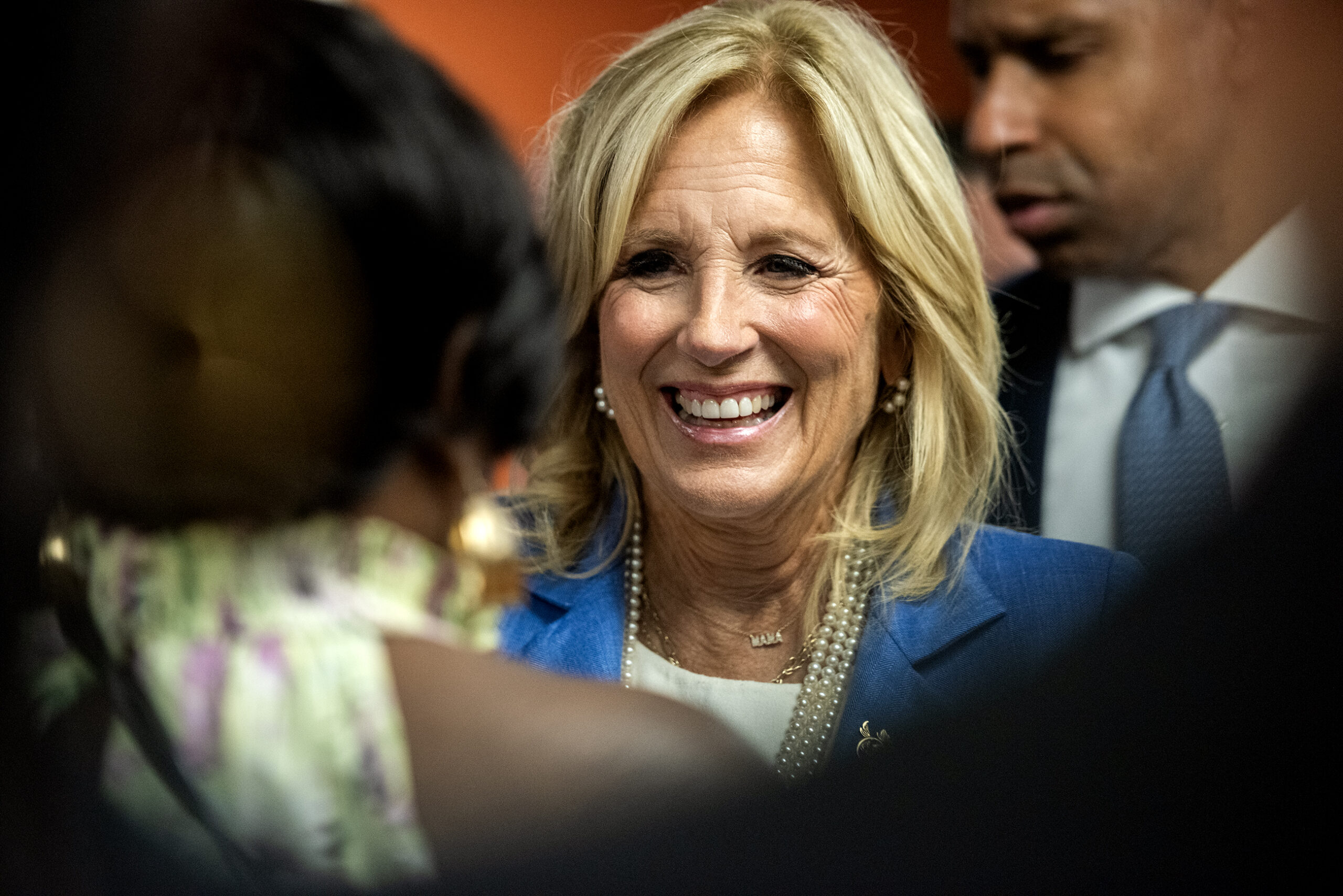 Jill Biden smiles as she greets attendees.