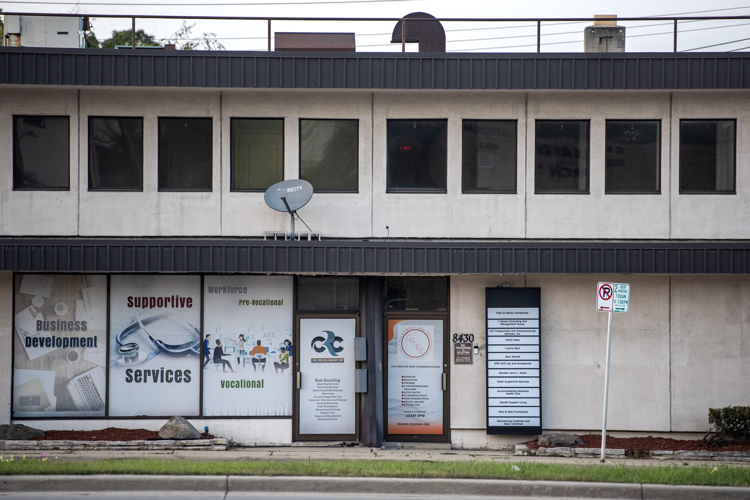 Signs cover the windows and walls.