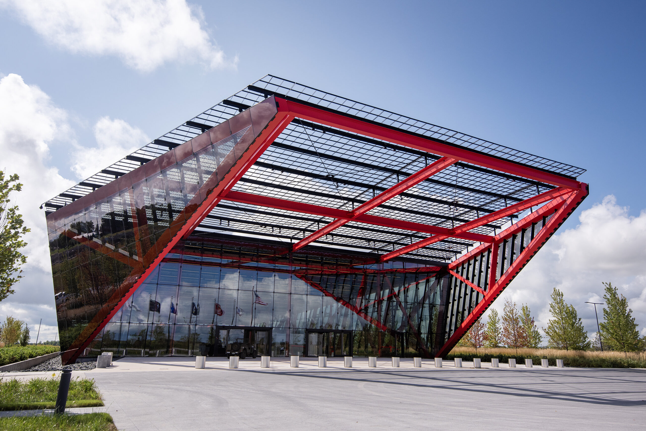 An angular building with bright red beams.