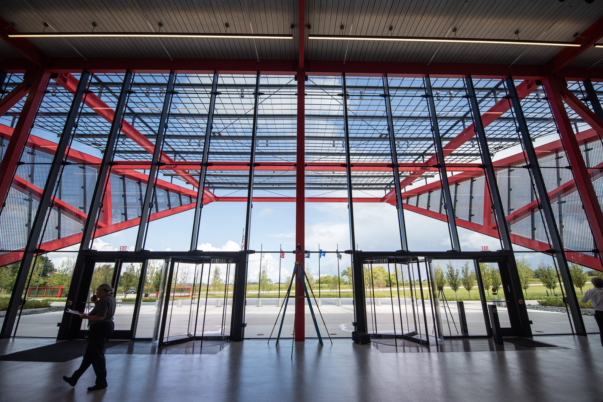 Angular details of the modern style building can be seen through large glass walls.