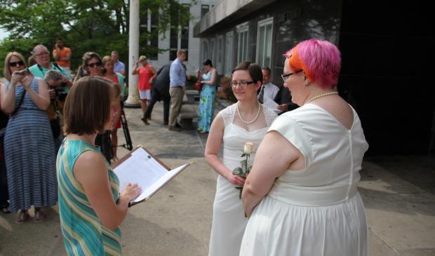 Cody Houston (pictured left) married Tina Cady (pictured right) at Madison's City-County Building