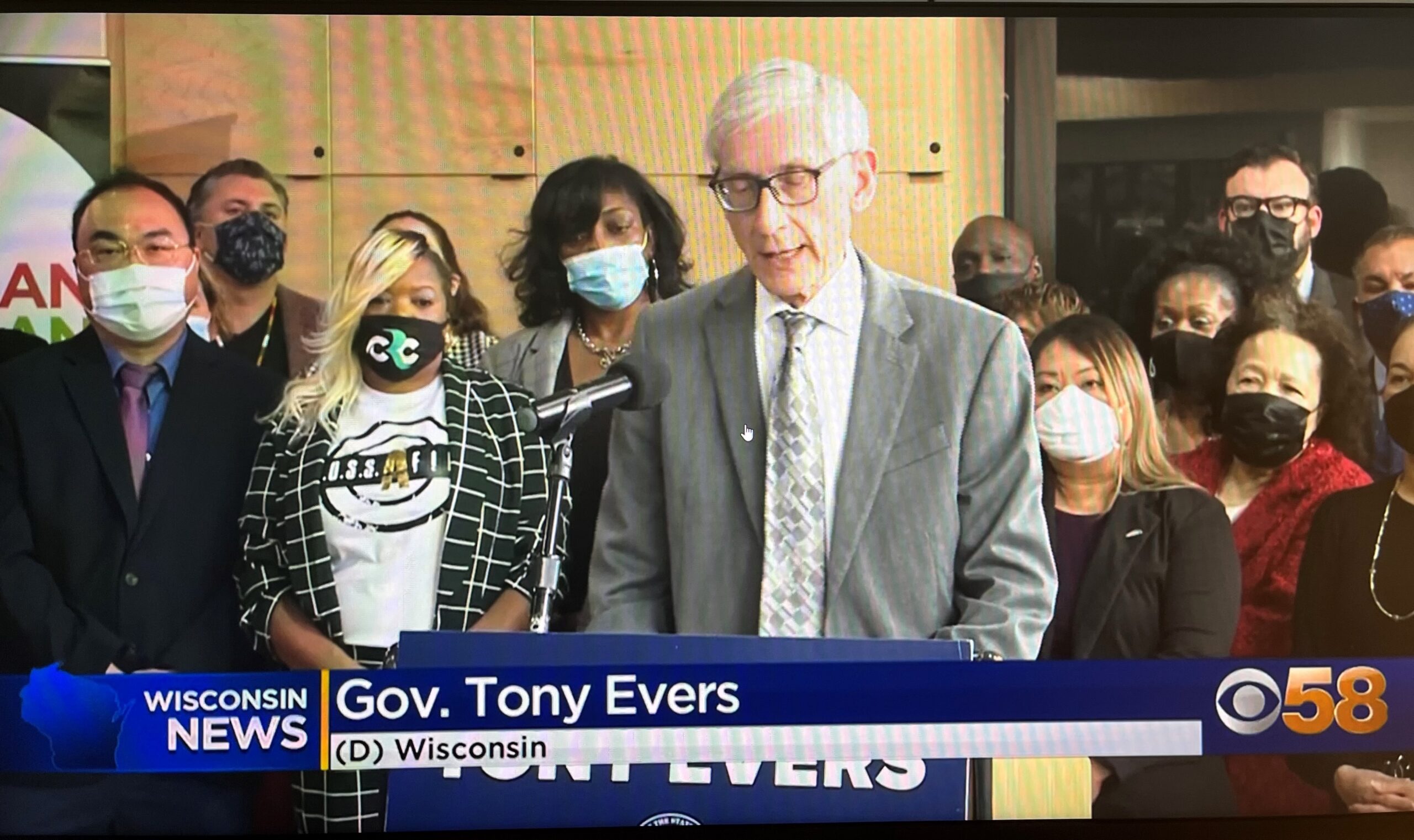 Cynthia Brown, third from left, participates in a March 2022 news conference organized by the Gov. Tony Evers to highlight the small business grant program.