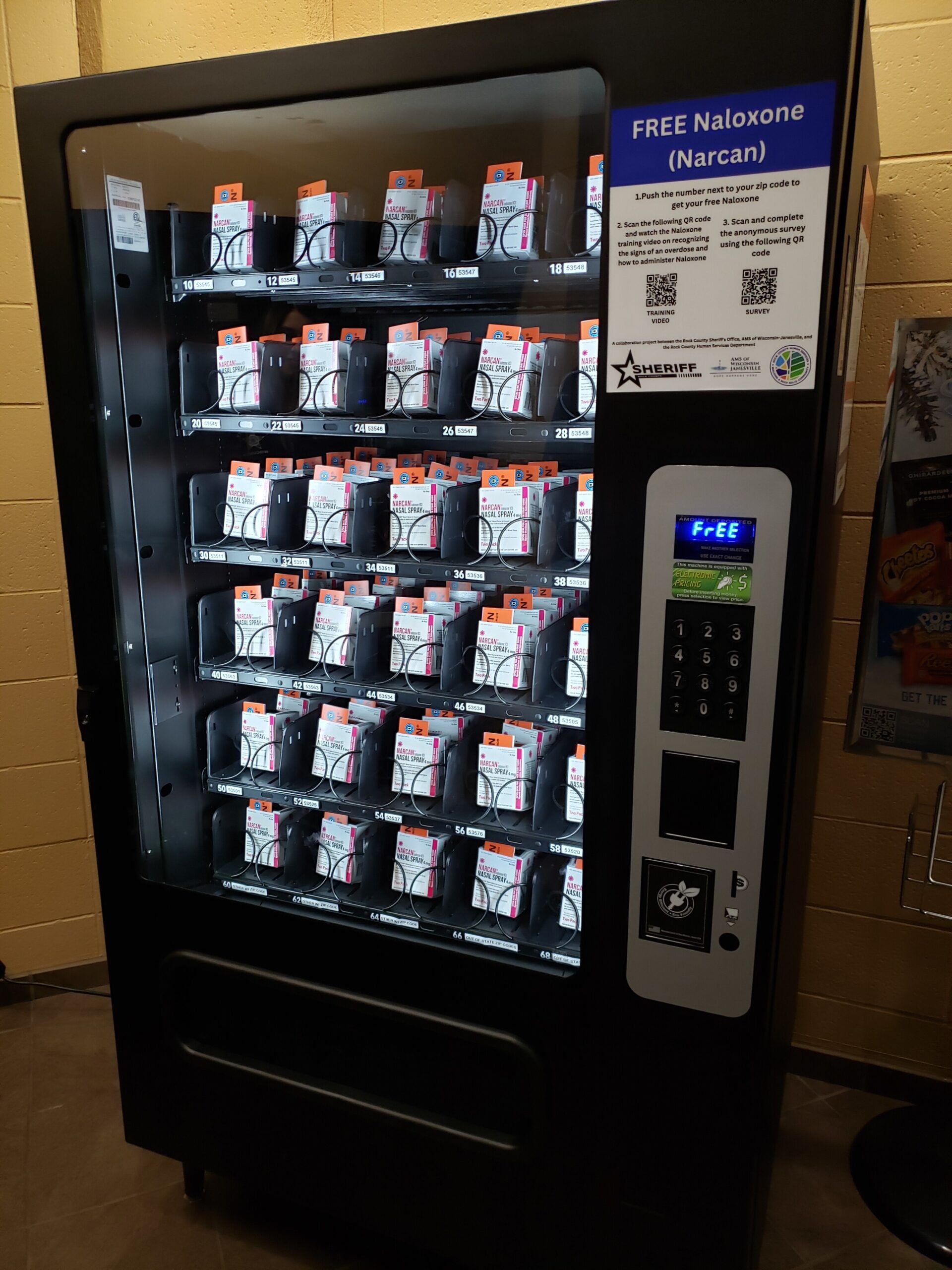 A vending machine filled with boxes of Narcan