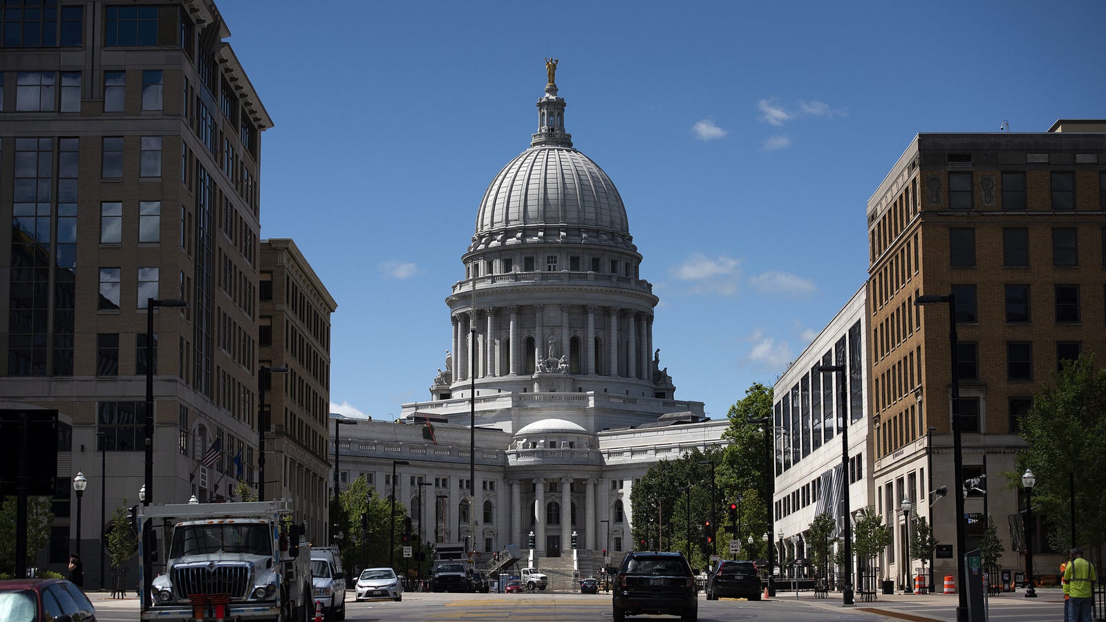 Buildings flank the Wisconsin State Capitol