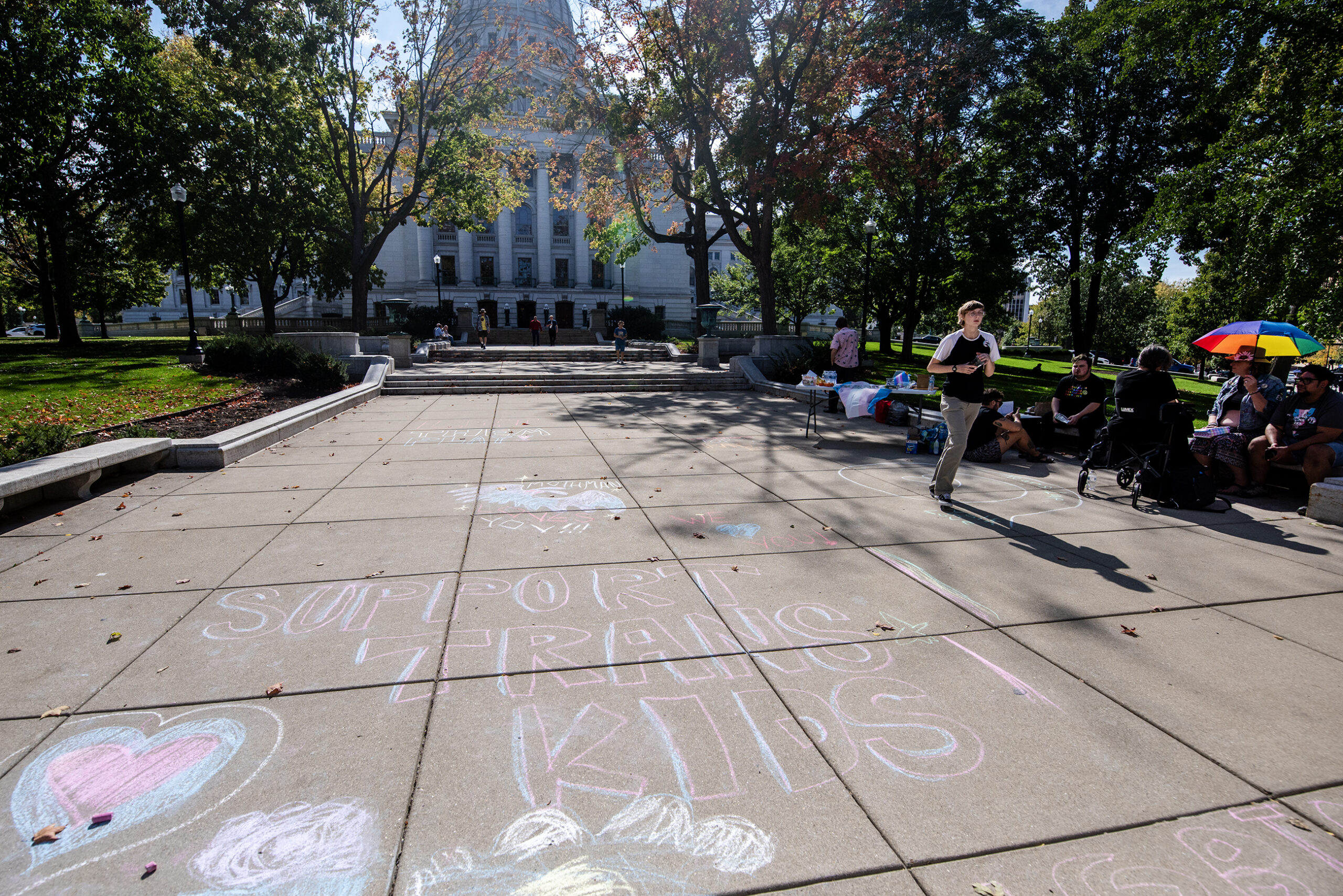 Sidewalk chalk art reads 