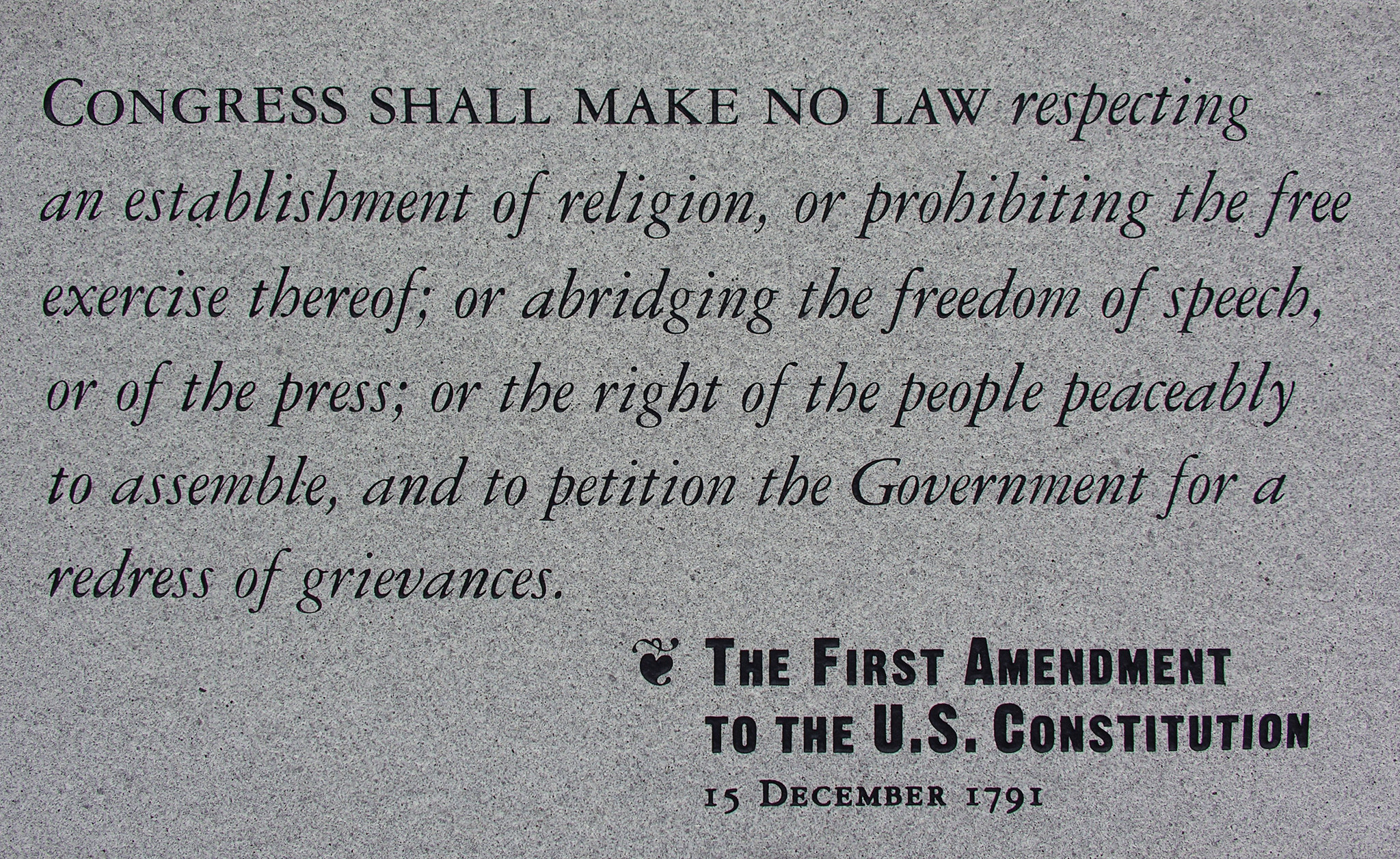 A stone etched with the First Amendment