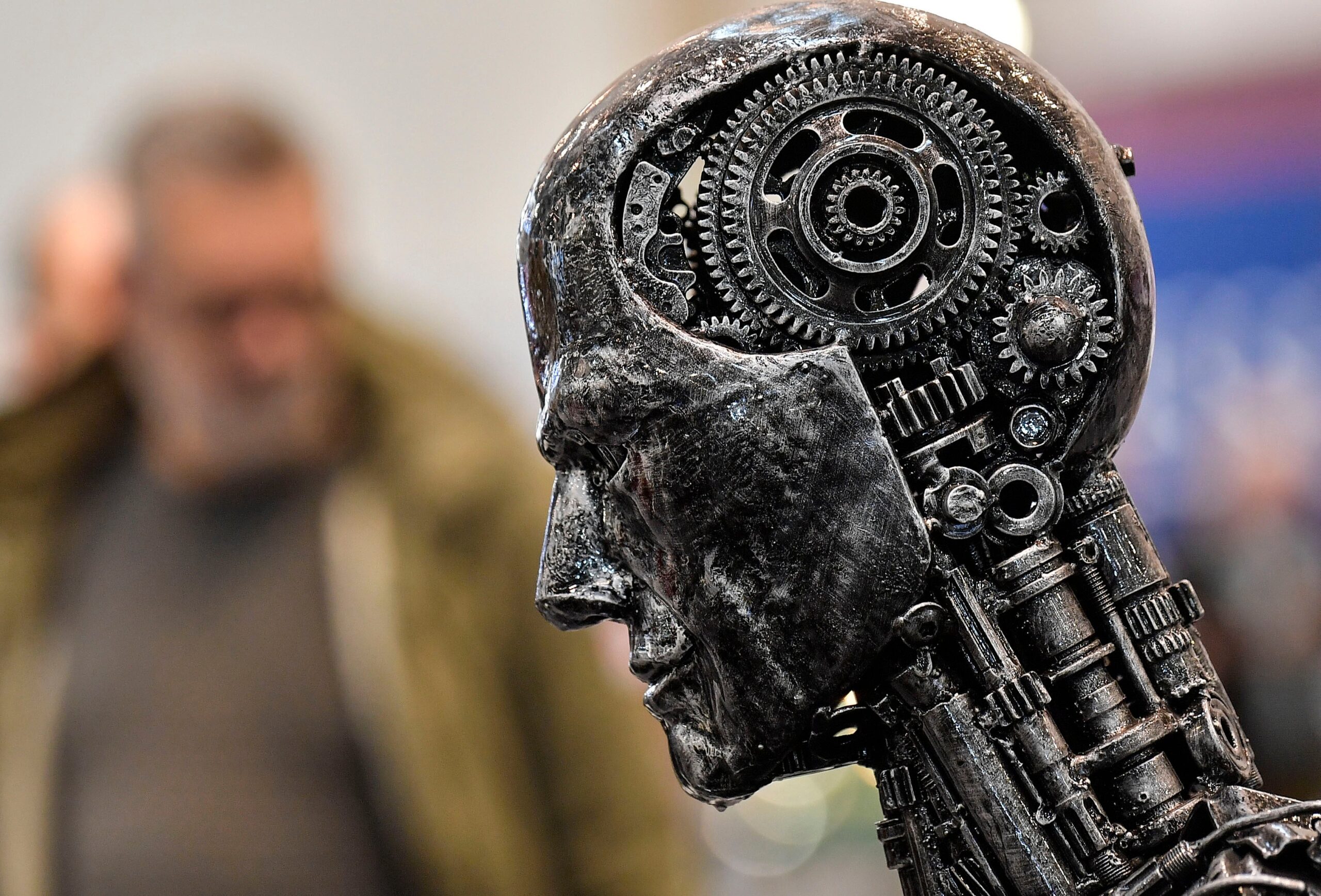 A metal head made of motor parts symbolizes artificial intelligence