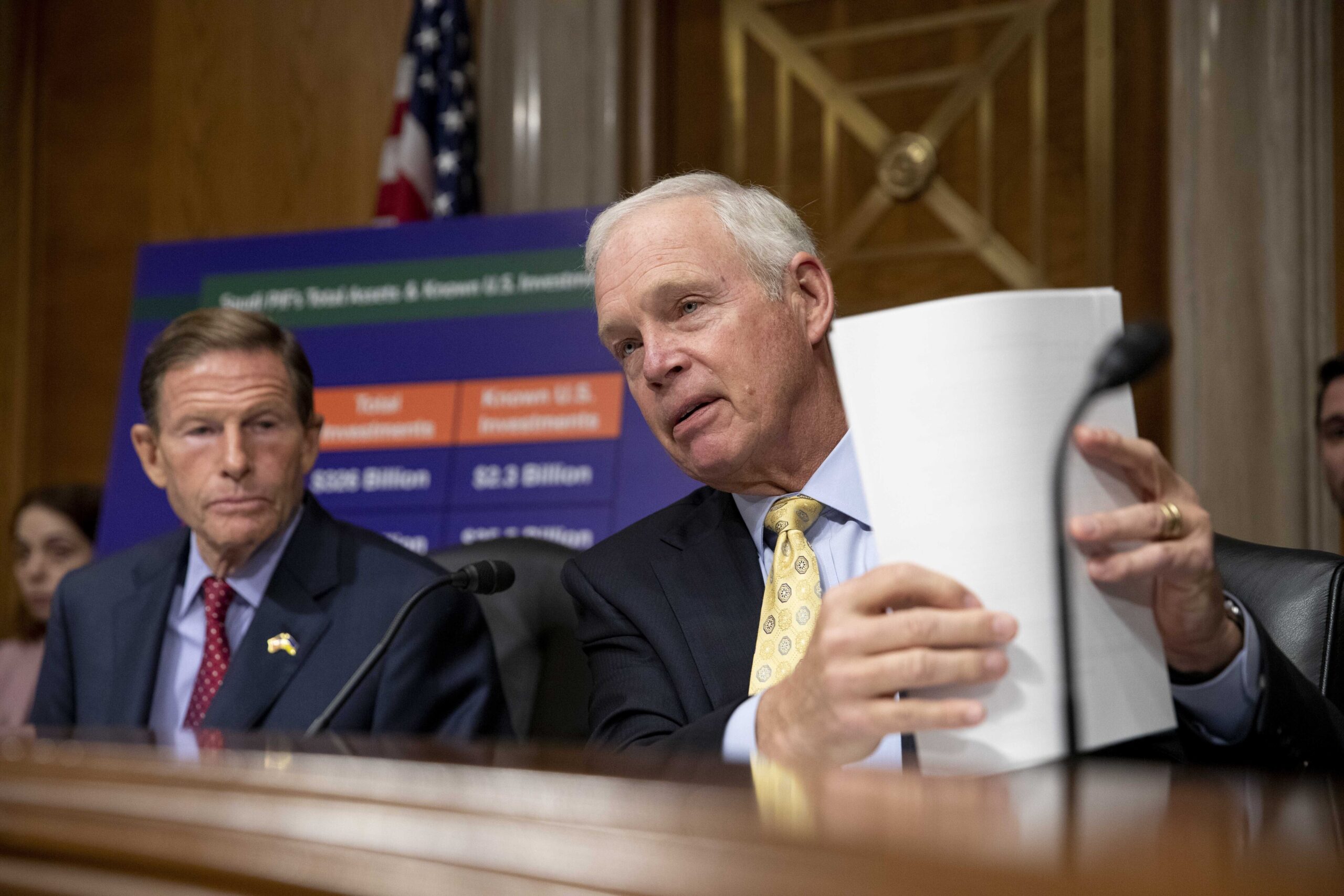 Sen. Ron Johnson holds papers during a congressional subcommittee meeting on Capitol Hill