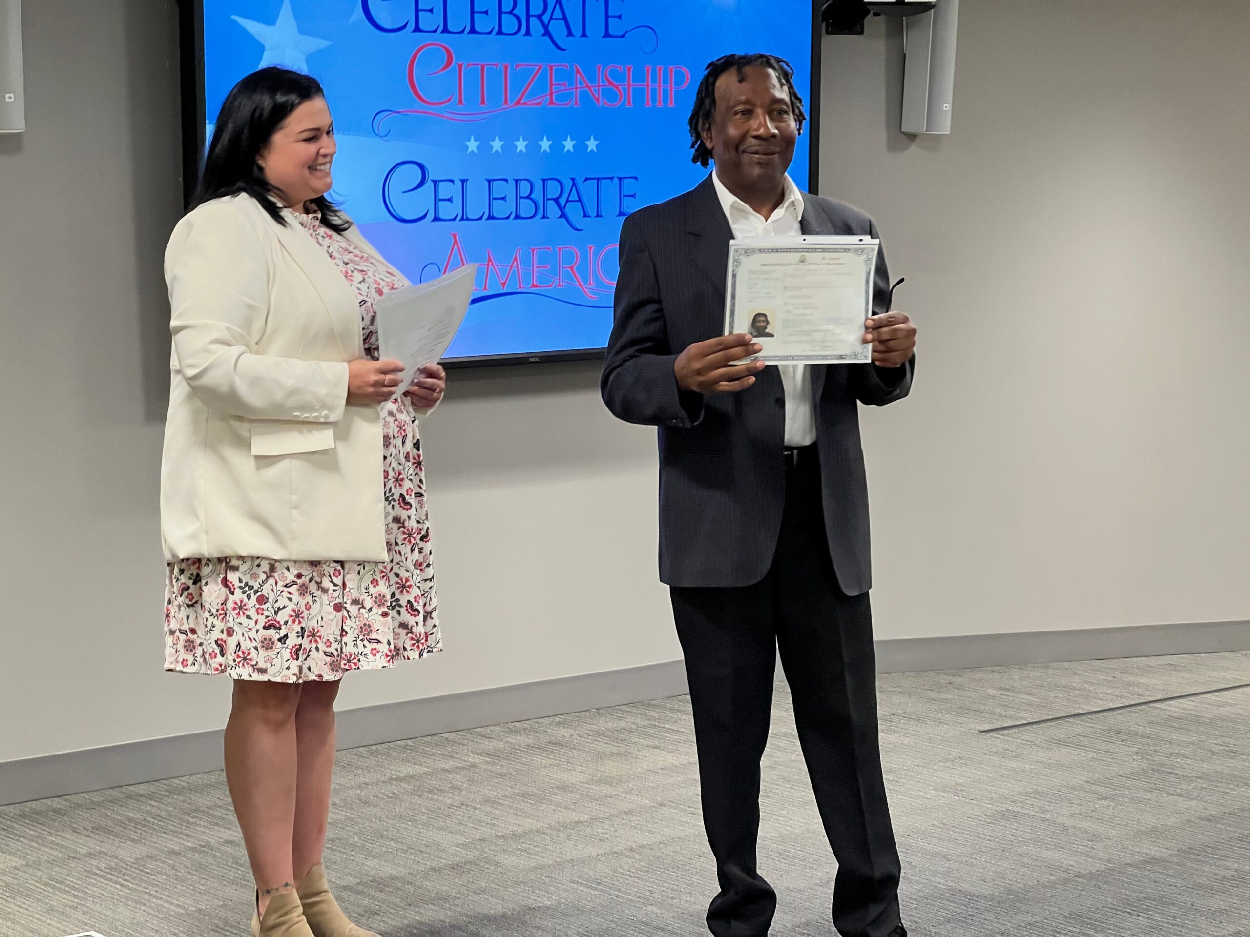 Ernesto Rodriguez of La Crosse, Wisconsin receives his certificate of naturalization at a USCIS field office in Minneapolis, Minnesota