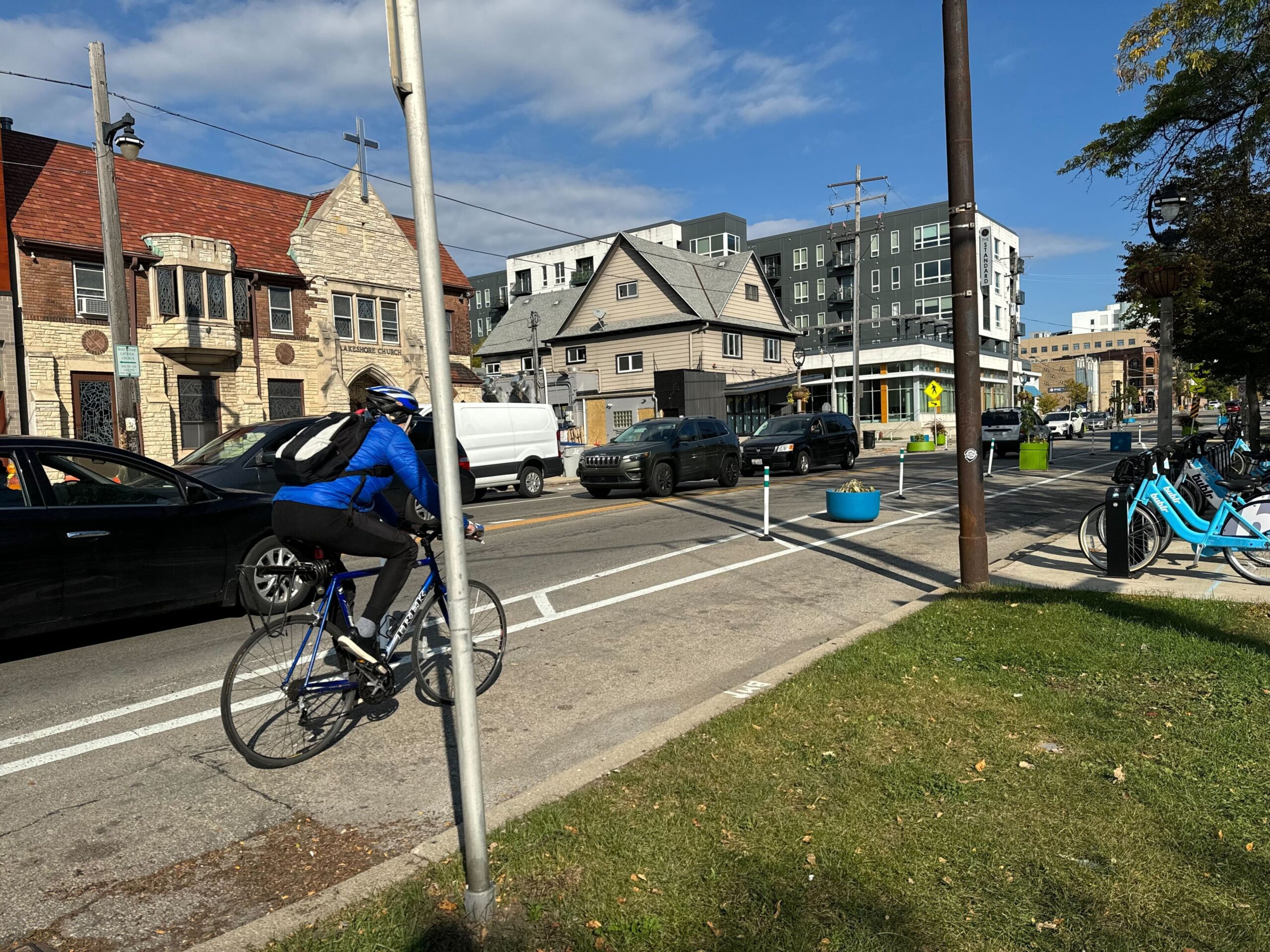 A cyclist uses a protected bike lane on Milwaukee's east side.
