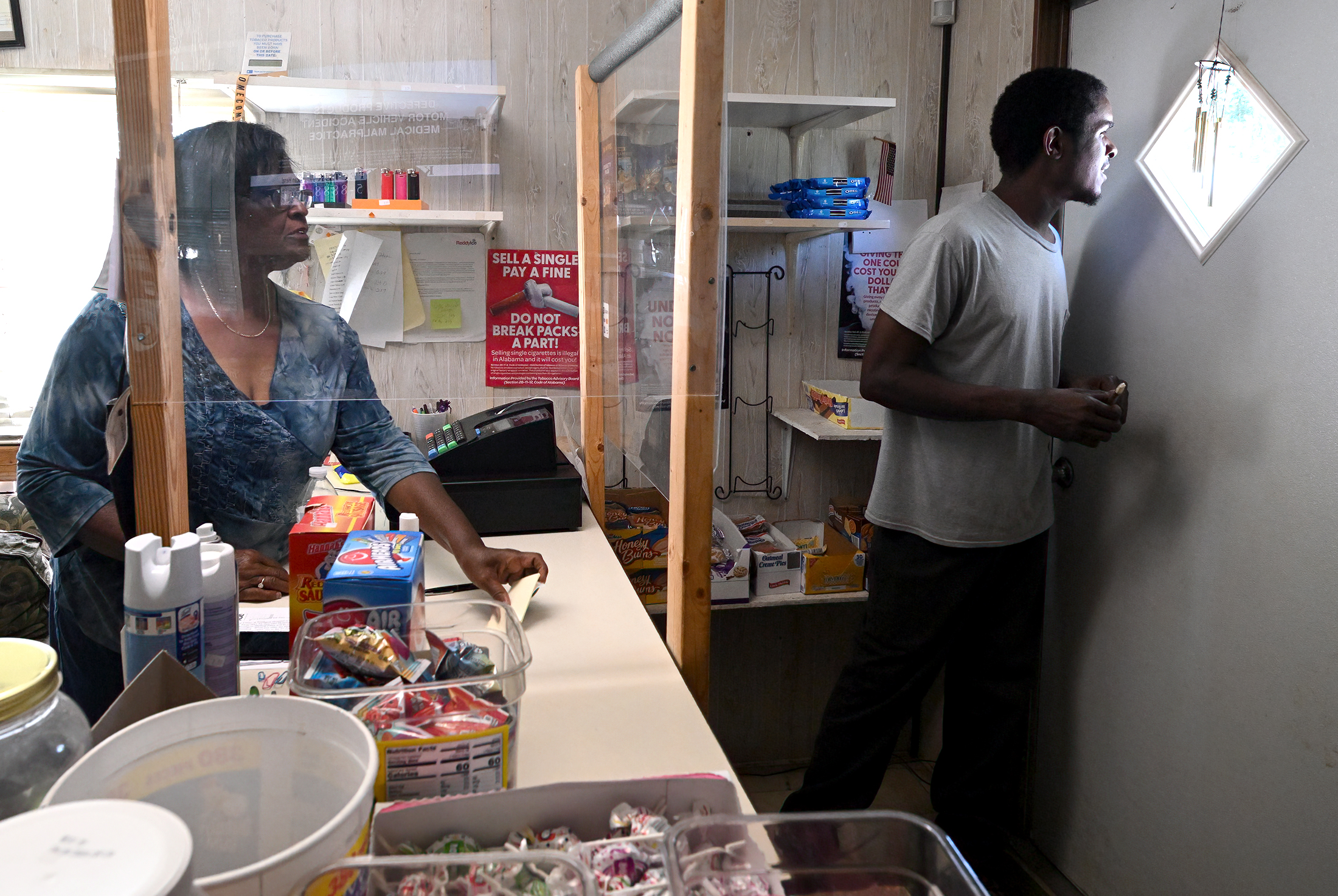Dorothy Oliver and Cedric Magee are shown in Oliver’s convenience store in Panola, Alabama