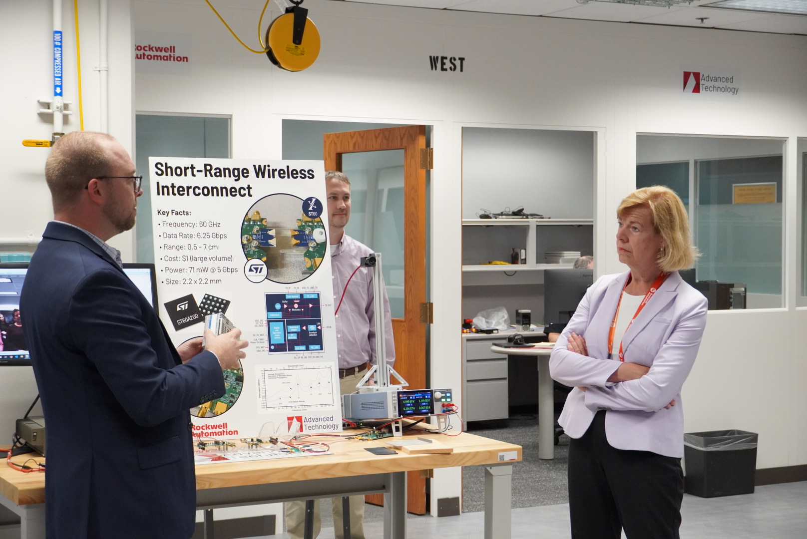 U.S. Sen. Tammy Baldwin meets with an official from Rockwell Automation earlier this year.