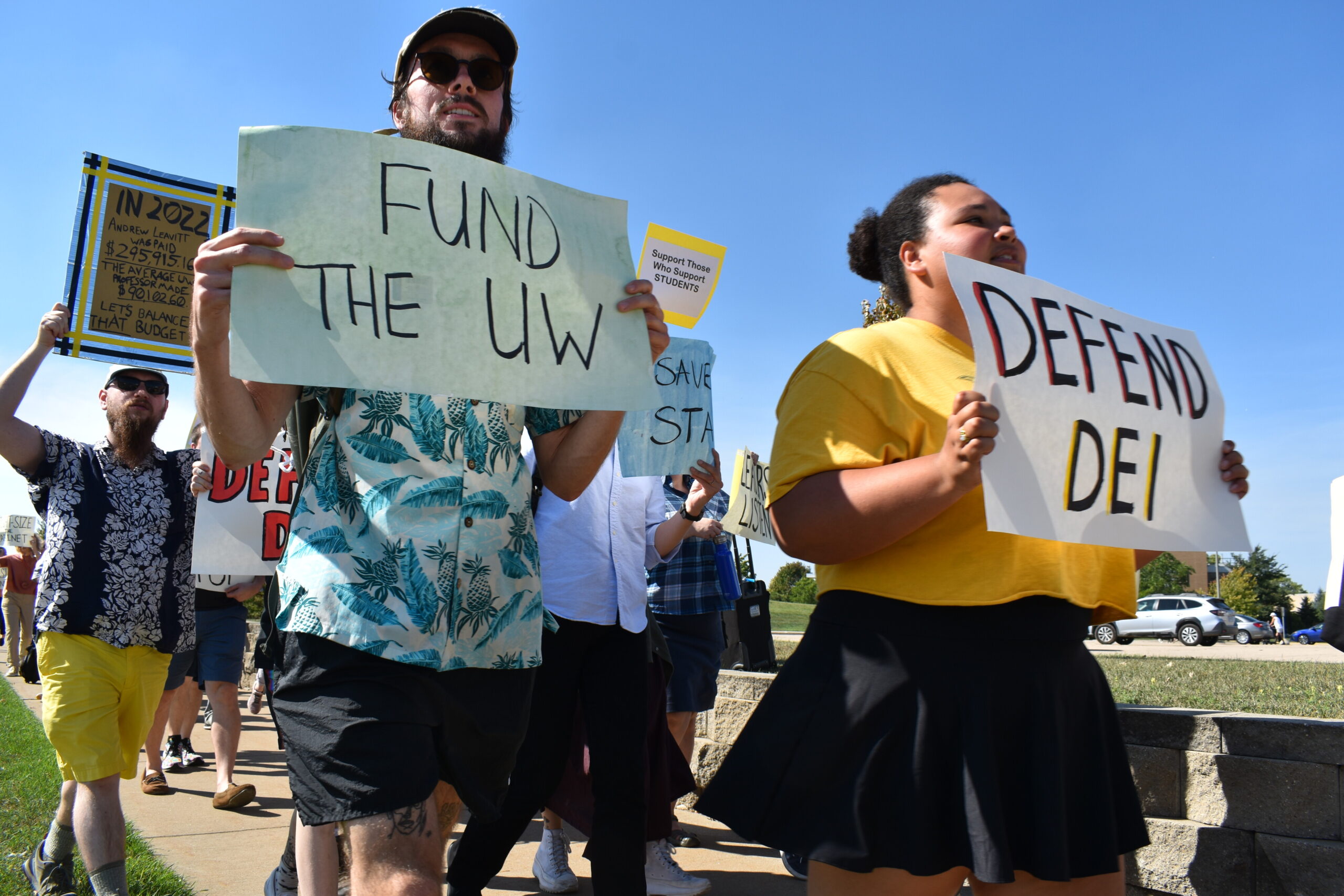 Dozens of community members march to protest UW-Oshkosh cuts