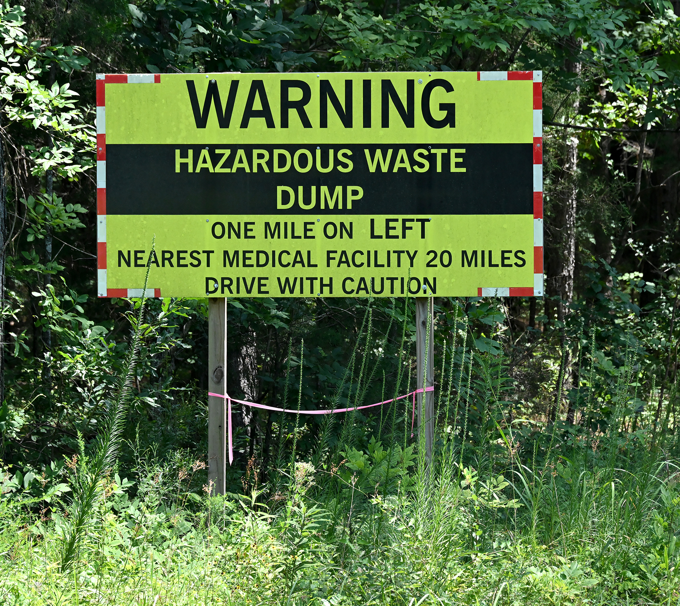 A warning sign is shown near the entrance of Chemical Waste Management’s hazardous waste landfill in Emelle, Alabama