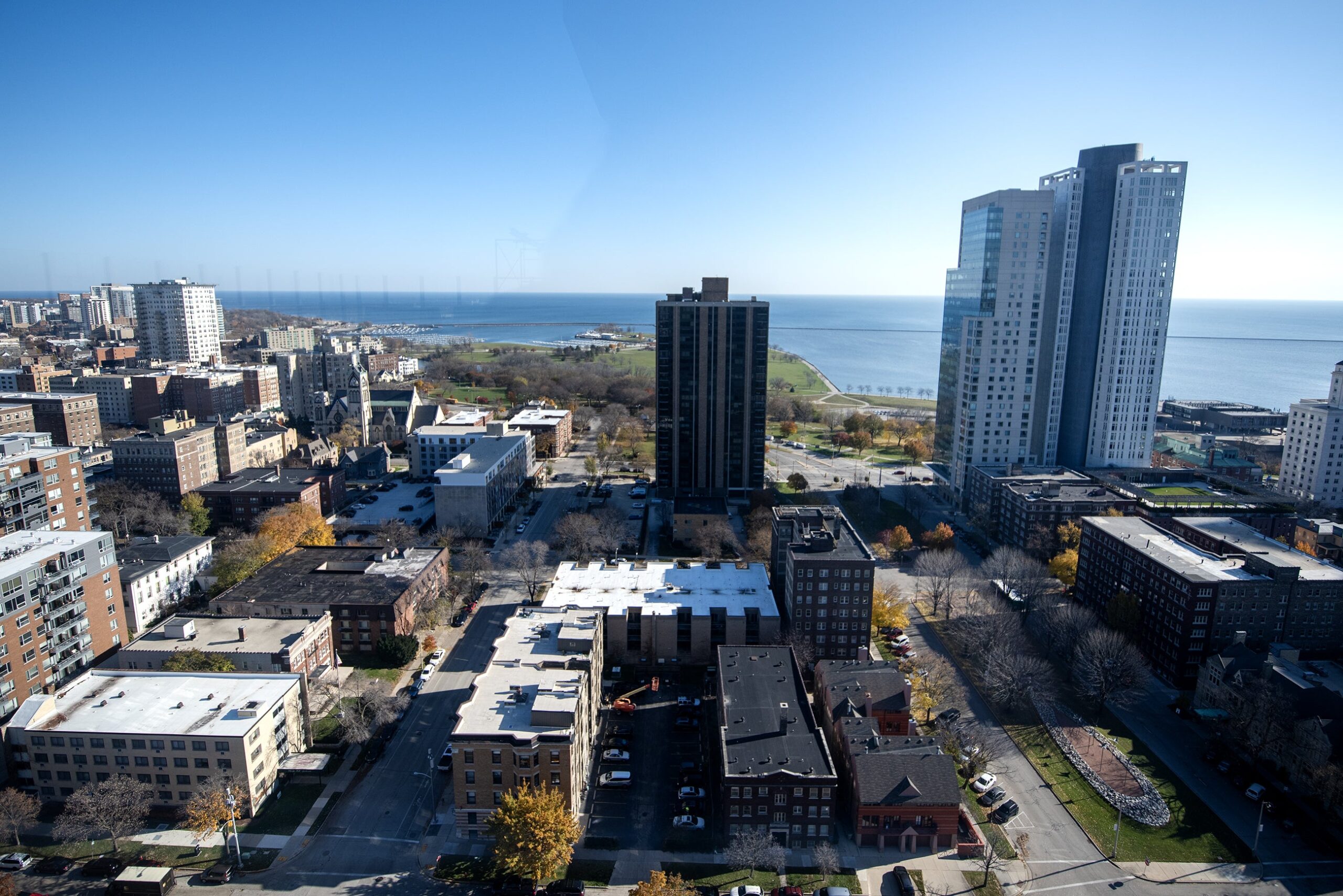 Buildings in Milwaukee are seen from above on a sunny day.