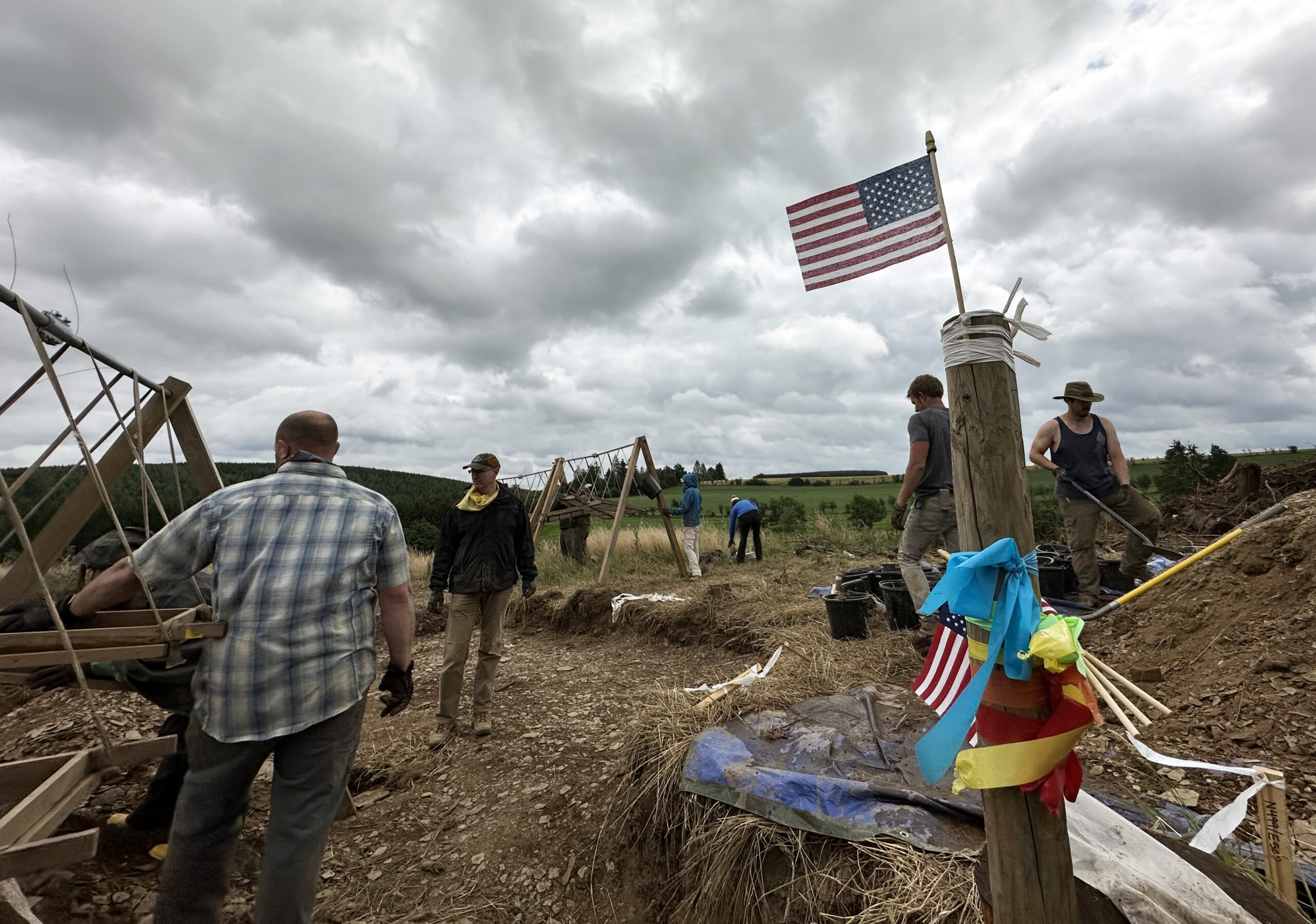 The UW-Madison MIA RIP team works to recover the remains of an American service member in Belgium during the summer of 2023. The team displayed American flags for the July 4 holiday.