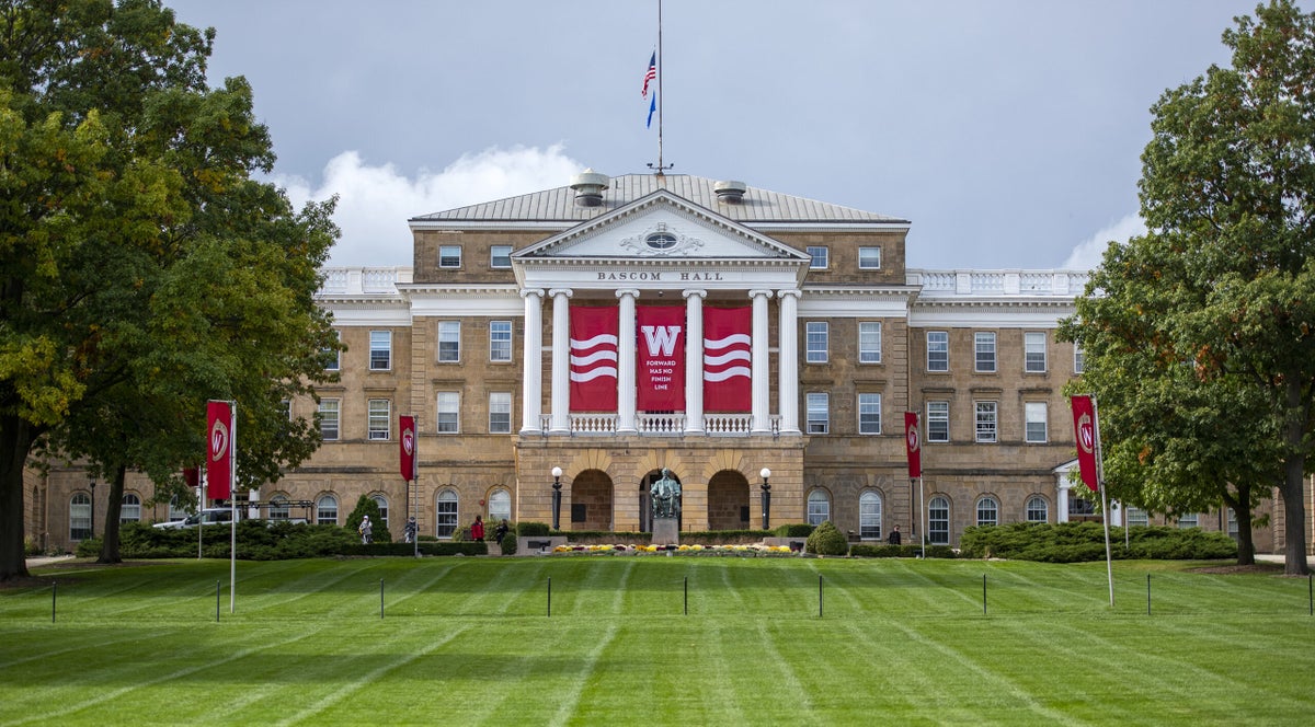 Green grass and a blue sky surround Bascom Hall.