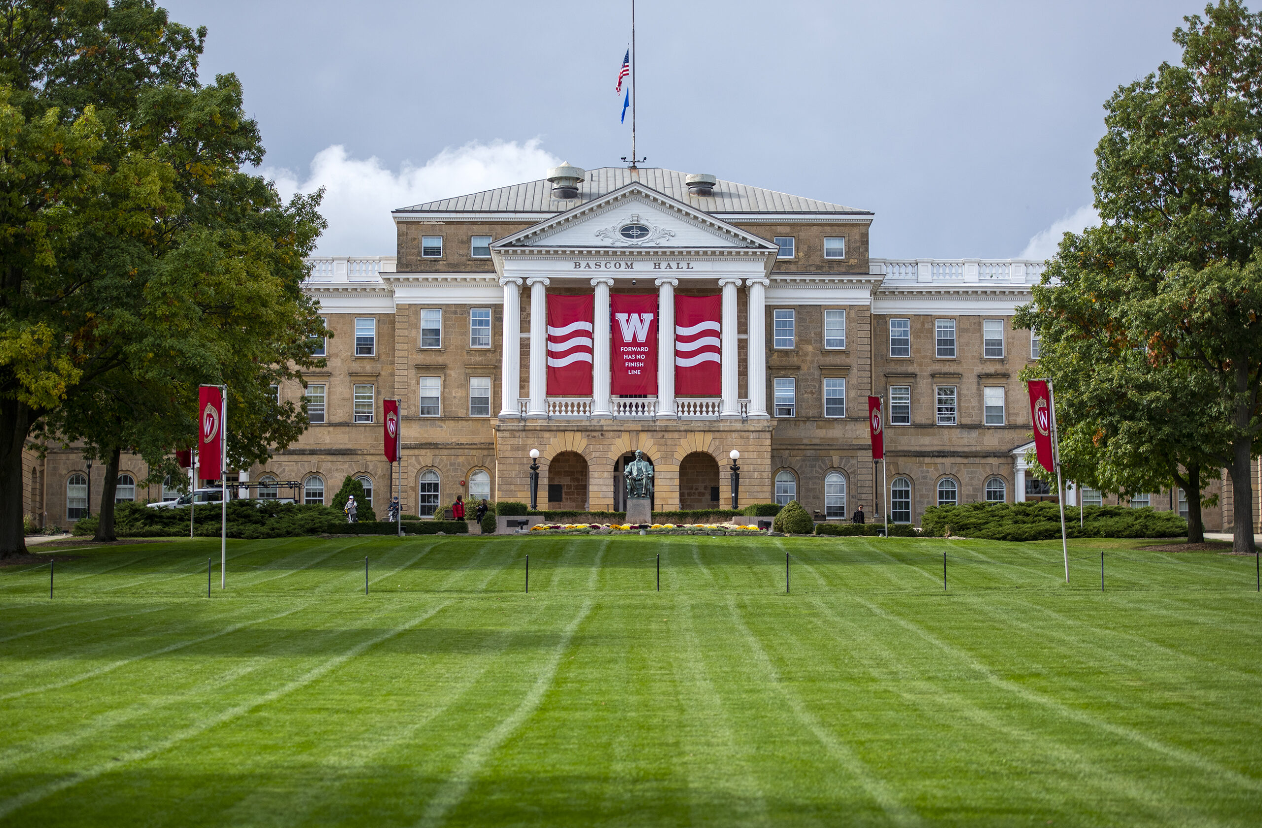 Green grass and a blue sky surround Bascom Hall.