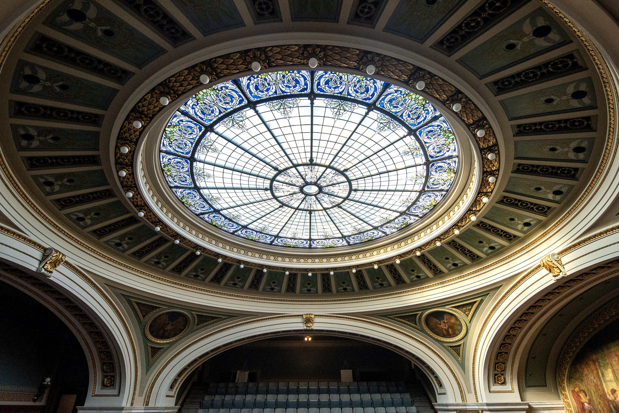 Decorative glass and other features are seen on the ceiling.