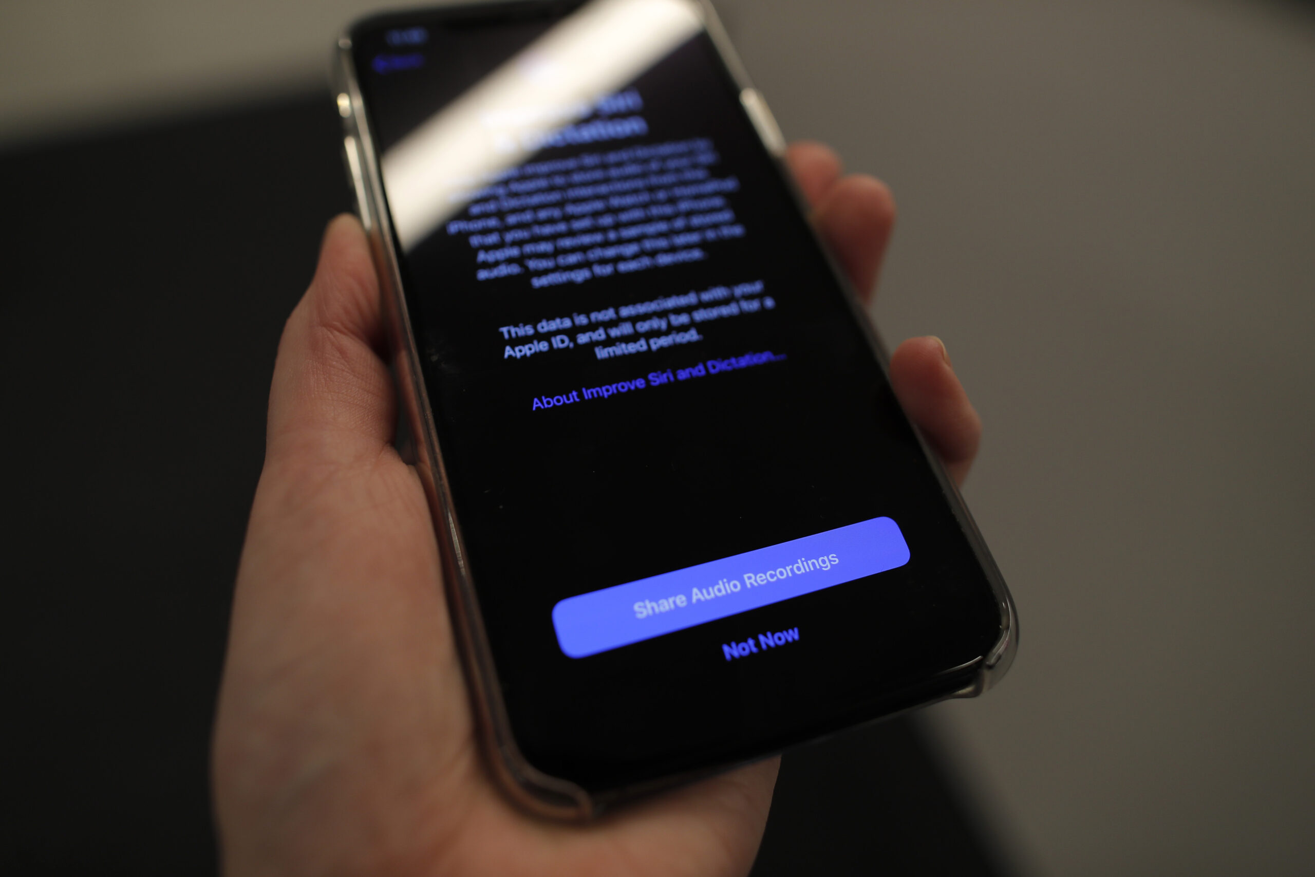 A cellphone screen displays a notice on suicide prevention