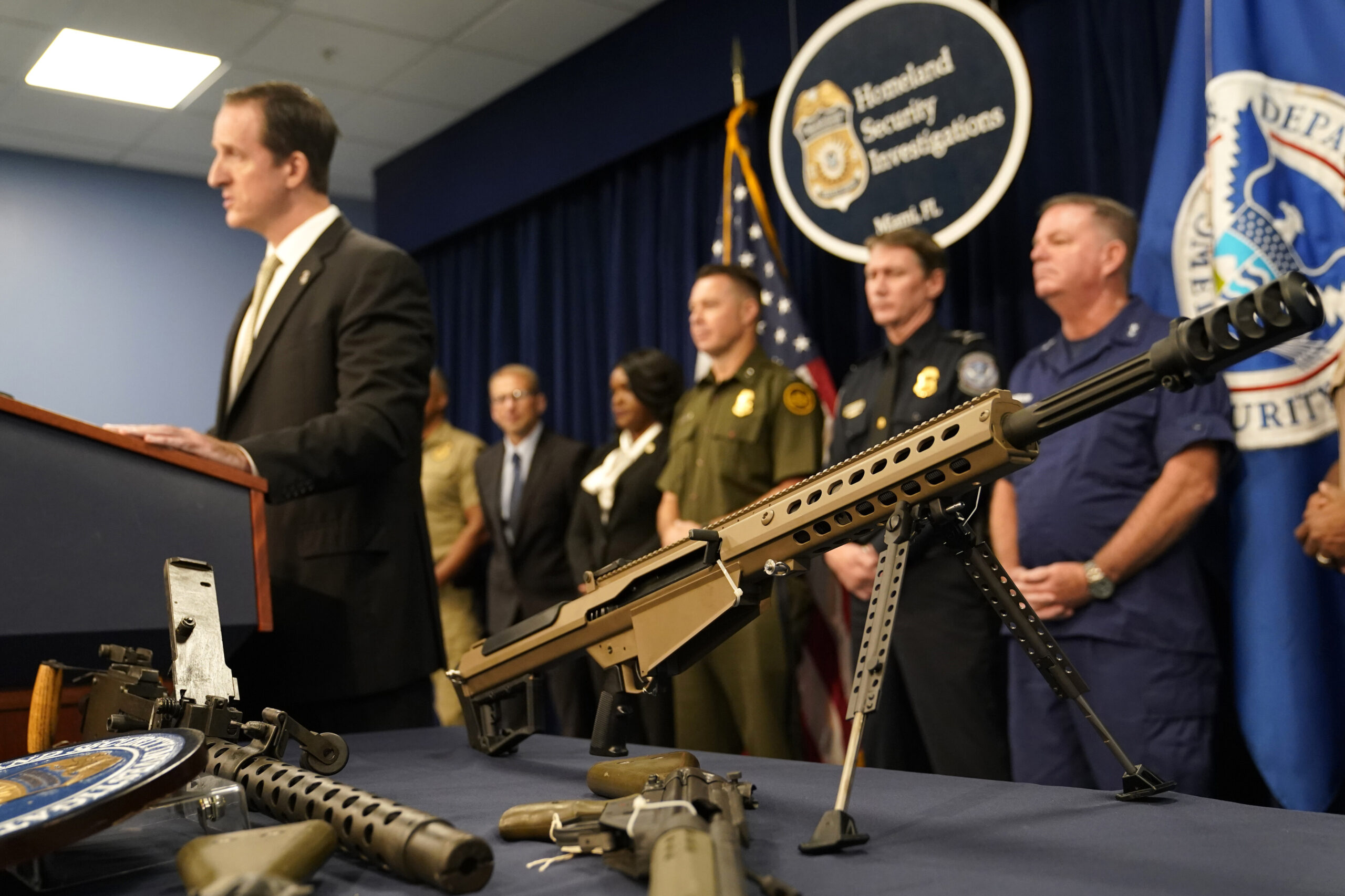 A Barrett .50 caliber sniper rifle is displayed during a news conference at the Homeland Security Investigations Miami Field Office