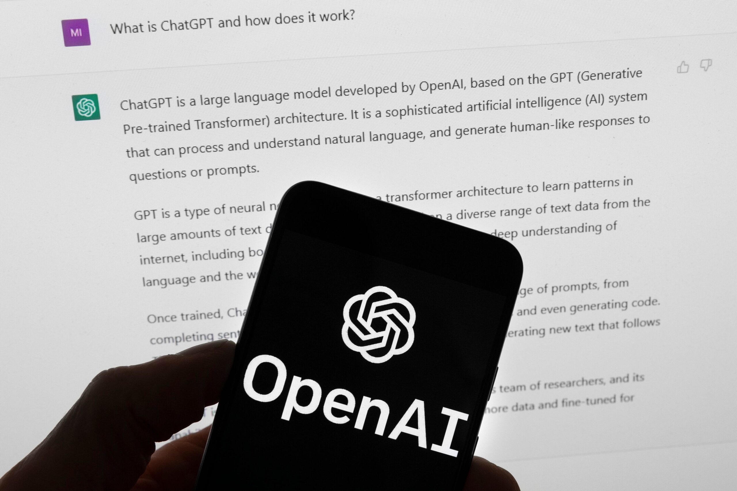 The OpenAI logo is seen on a mobile phone