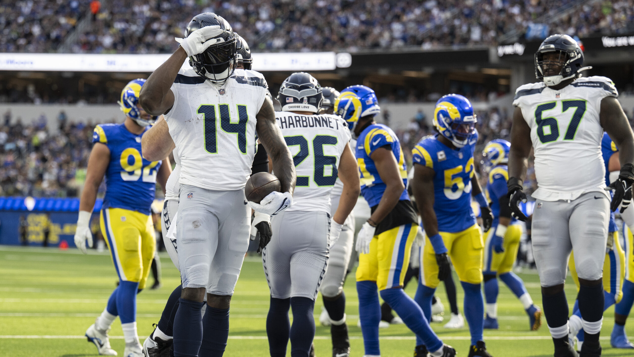 Seattle Seahawks wide receiver DK Metcalf (14) celebrates his touchdown by using American Sign Language during an NFL