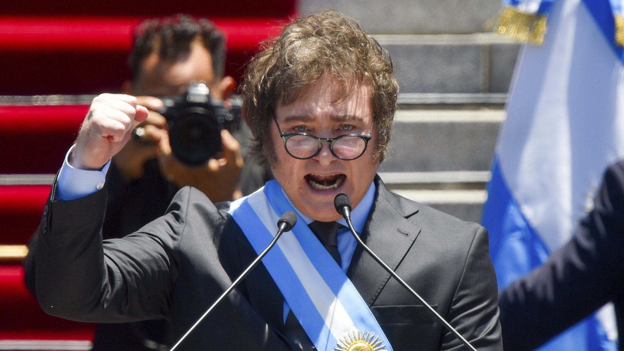 Argentina's newly sworn-in President Javier Milei speaks outside the Congress in Buenos Aires, Argentina, Sunday, Dec.