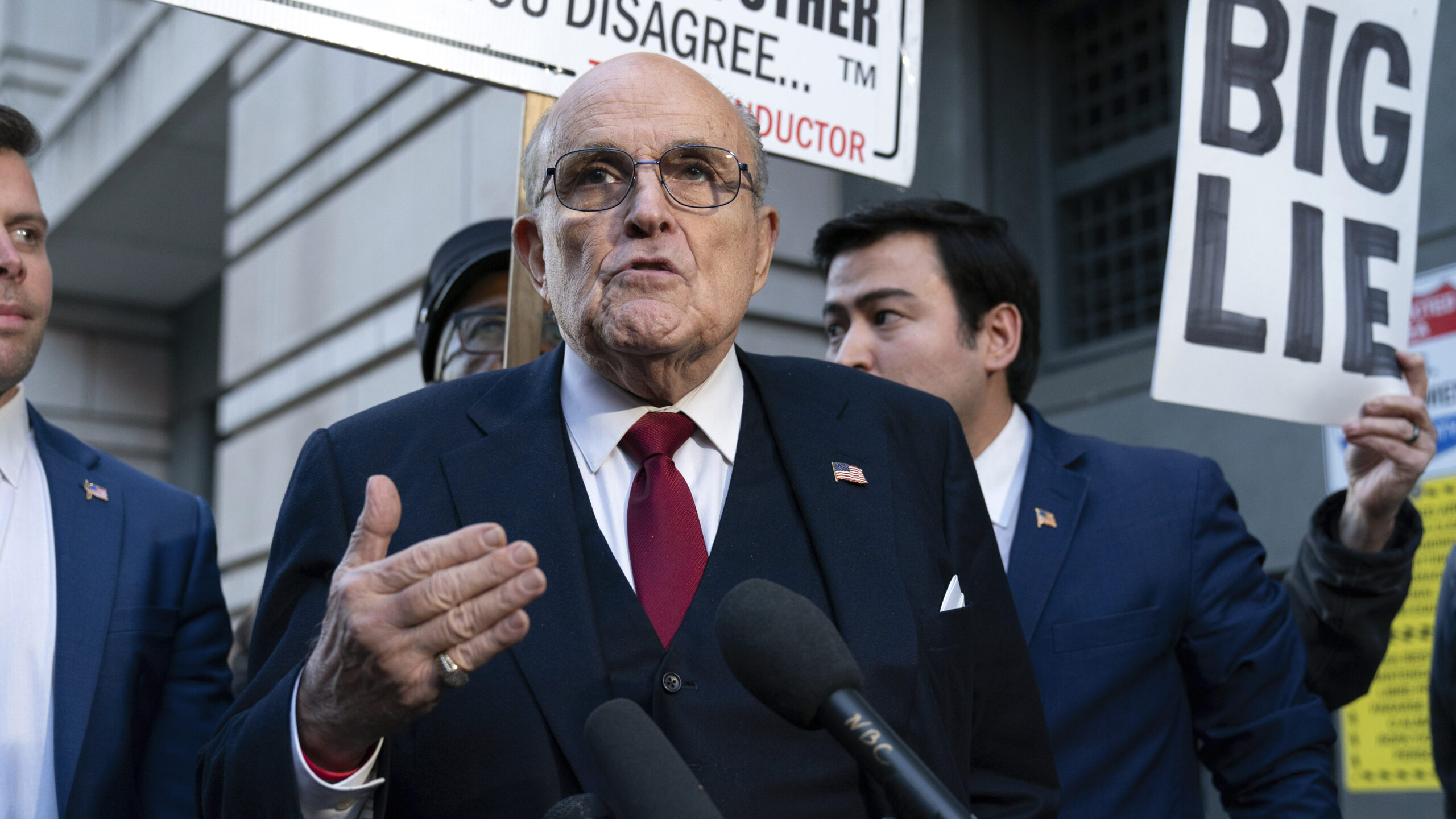 Rudy Giuliani speaks during a news conference after his defamation trial outside the federal courthouse in Washington,