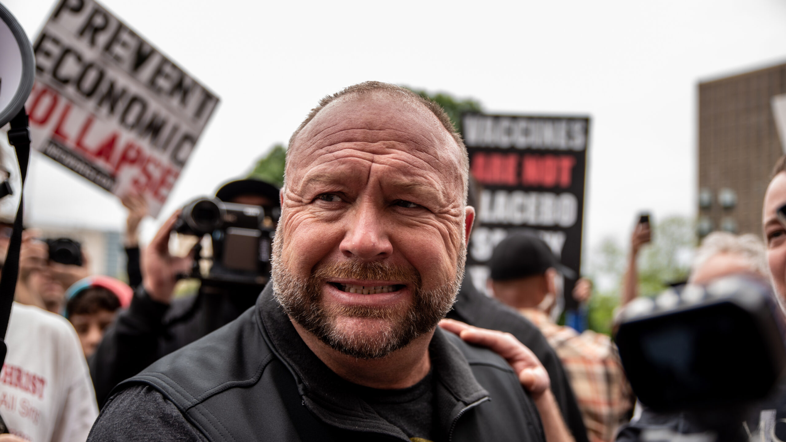 Infowars founder Alex Jones interacts with supporters at the Texas State Capital building on April 18, 2020, in Austin.