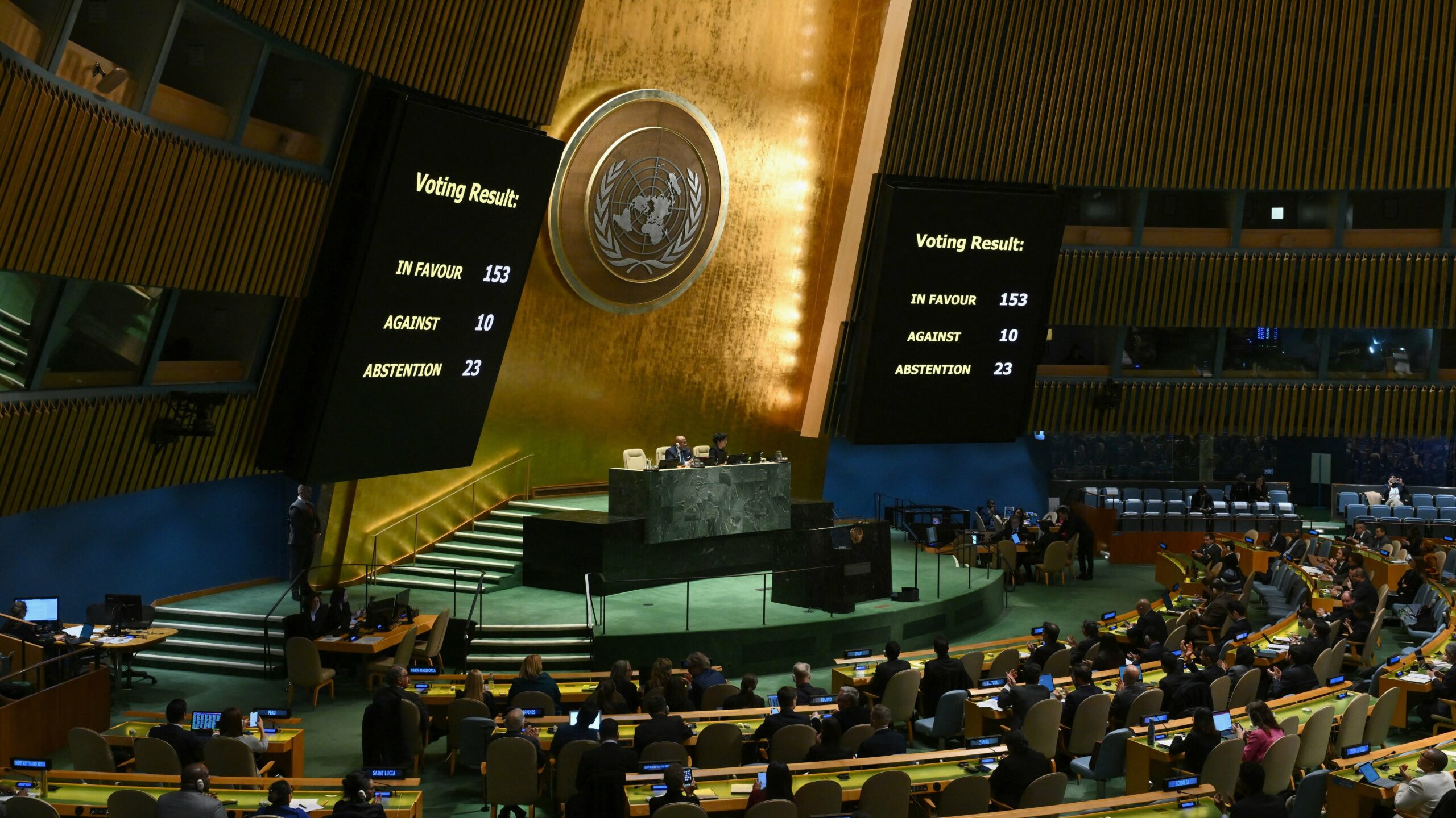 A general view shows voting results during a United Nations General Assembly meeting to vote on a non-binding resolution