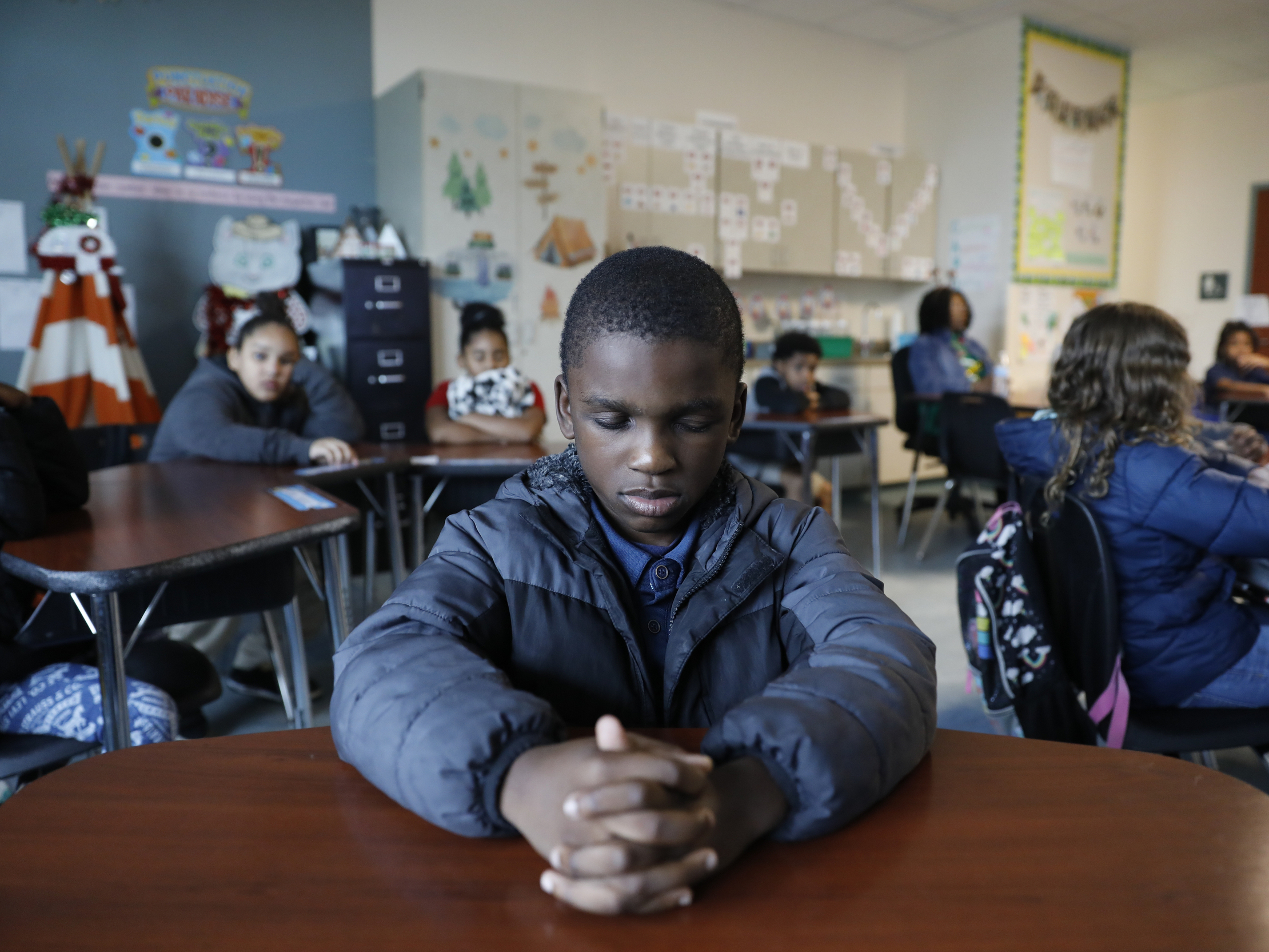 To help these school kids deal with trauma, mindfulness lessons over the loudspeaker