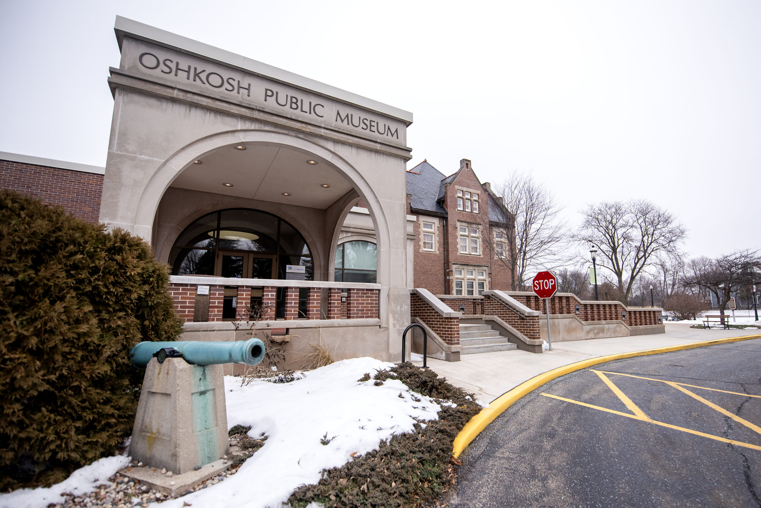 The exterior of the Oshkosh Public Museum on a cloudy day.