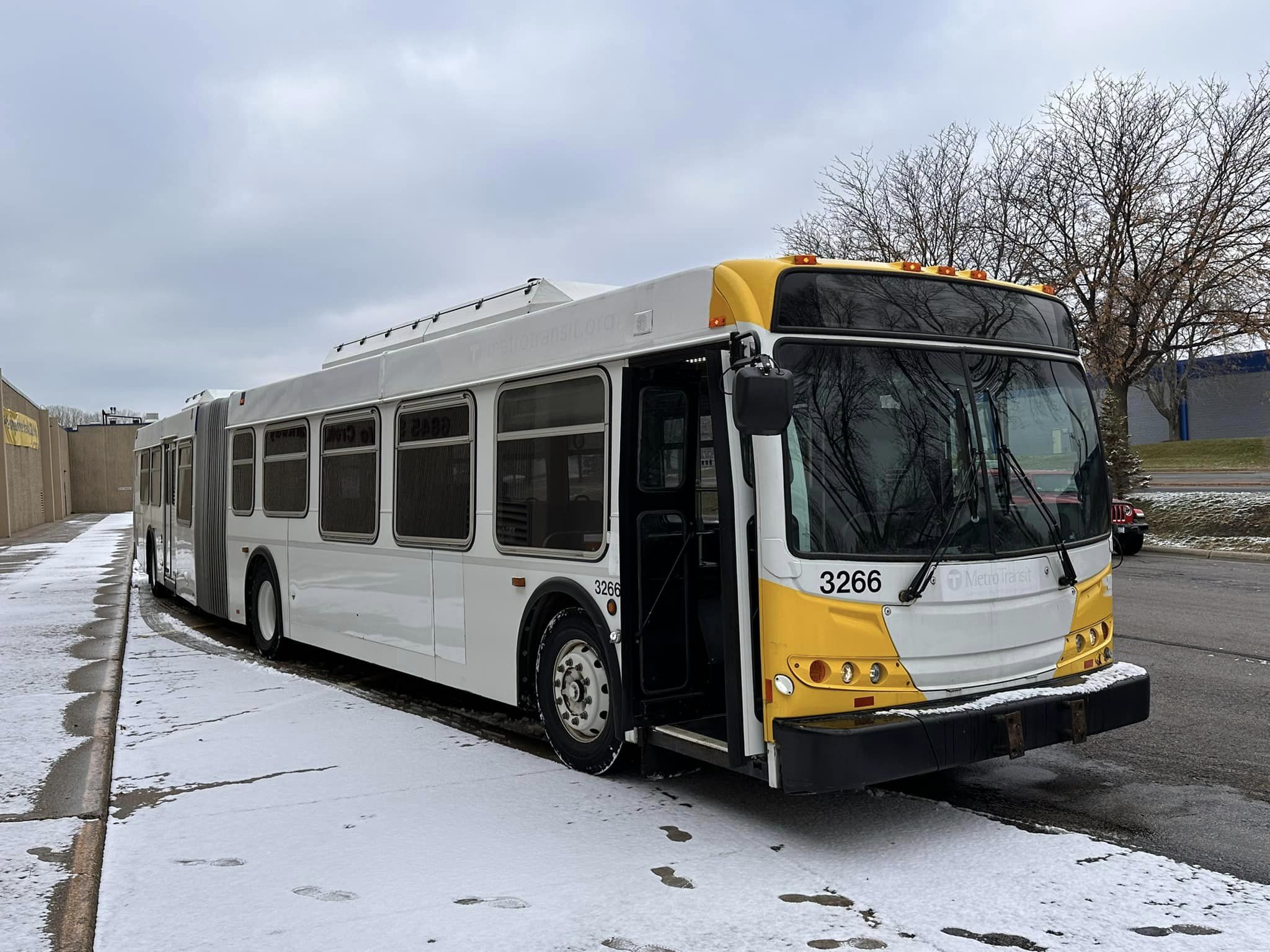 An extended bus on a snowy street