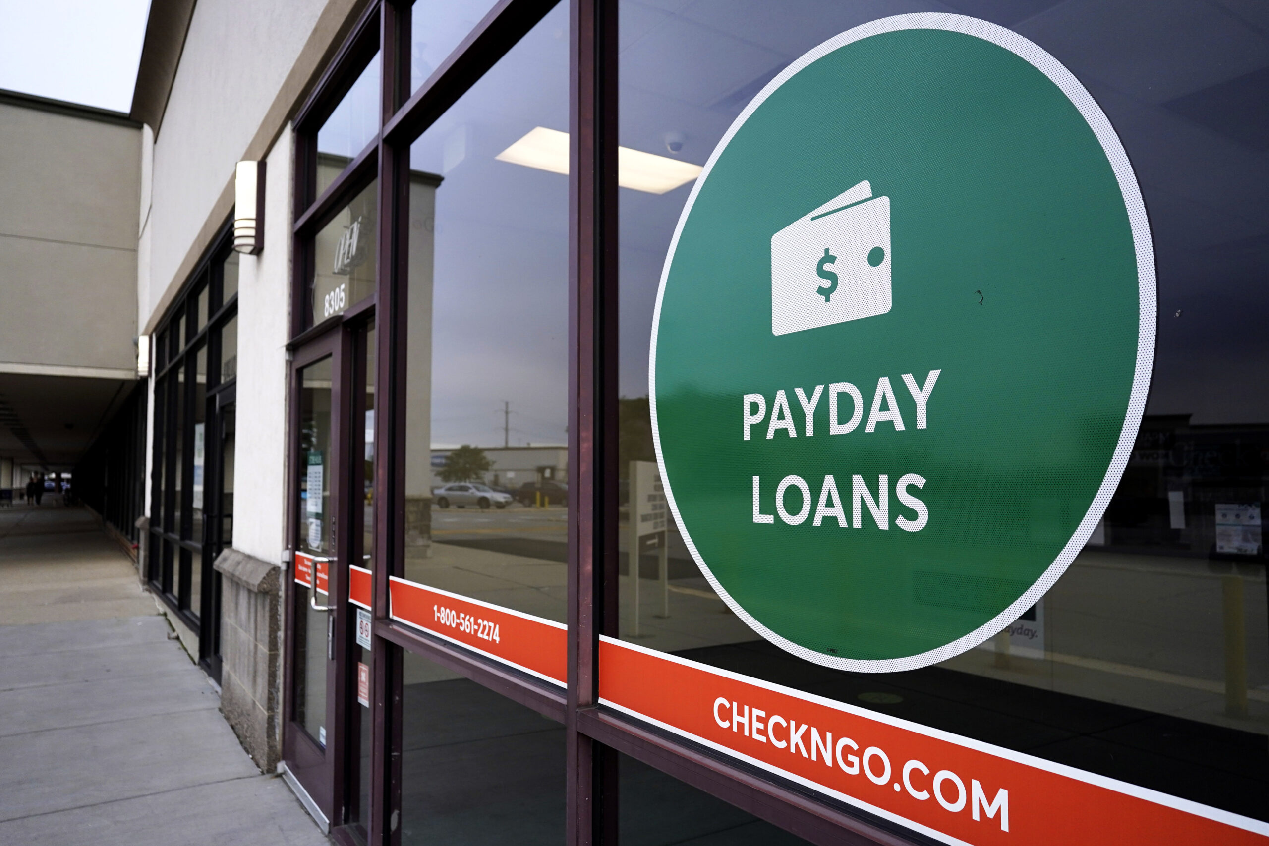 A "Payday Loans" sign is displayed at a Check'n Go