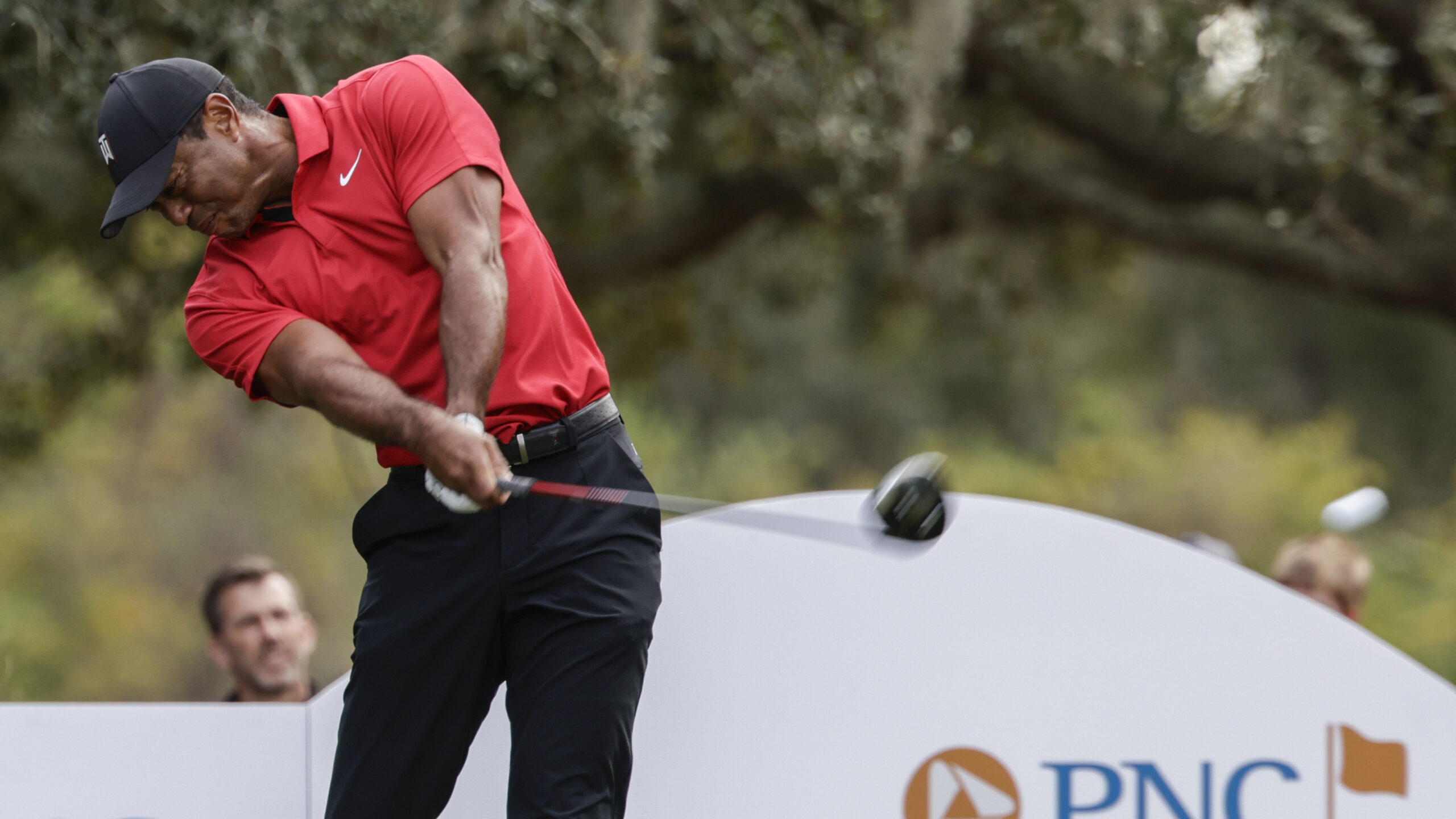 Tiger Woods tees off on the 13th hole during the final round of the PNC Championship golf tournament on Dec. 17 in