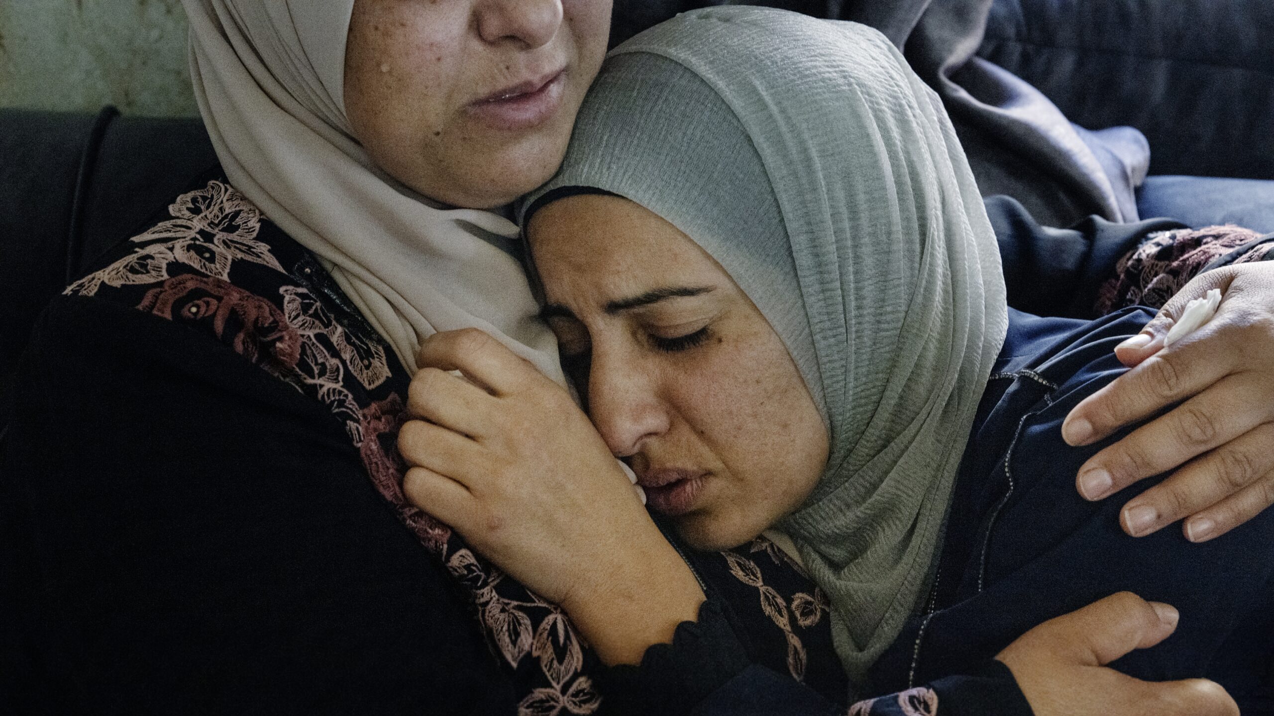 QUSRA, WEST BANK — Sisters, wives, mothers, and cousins of the village of Qusra gather to mourn their Palestinian loved