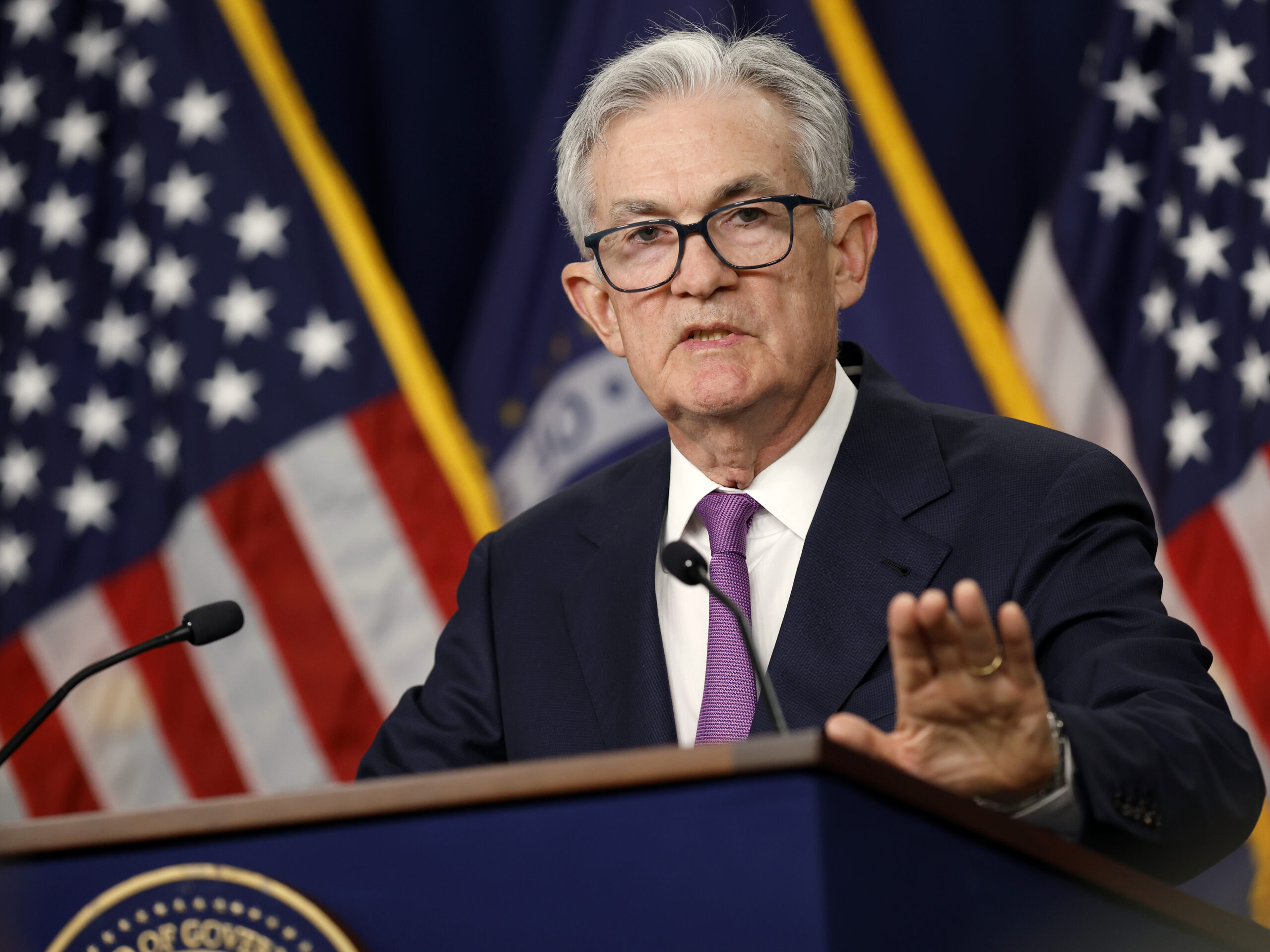 The Federal Reserve holds interest rates steady but signals rate cuts may be coming
