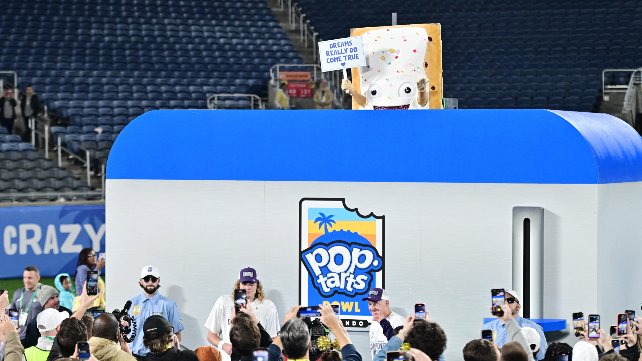 The Pop-Tarts mascot is lowered into a toaster following the 2023 Pop-Tarts Bowl between the Kansas State Wildcats and