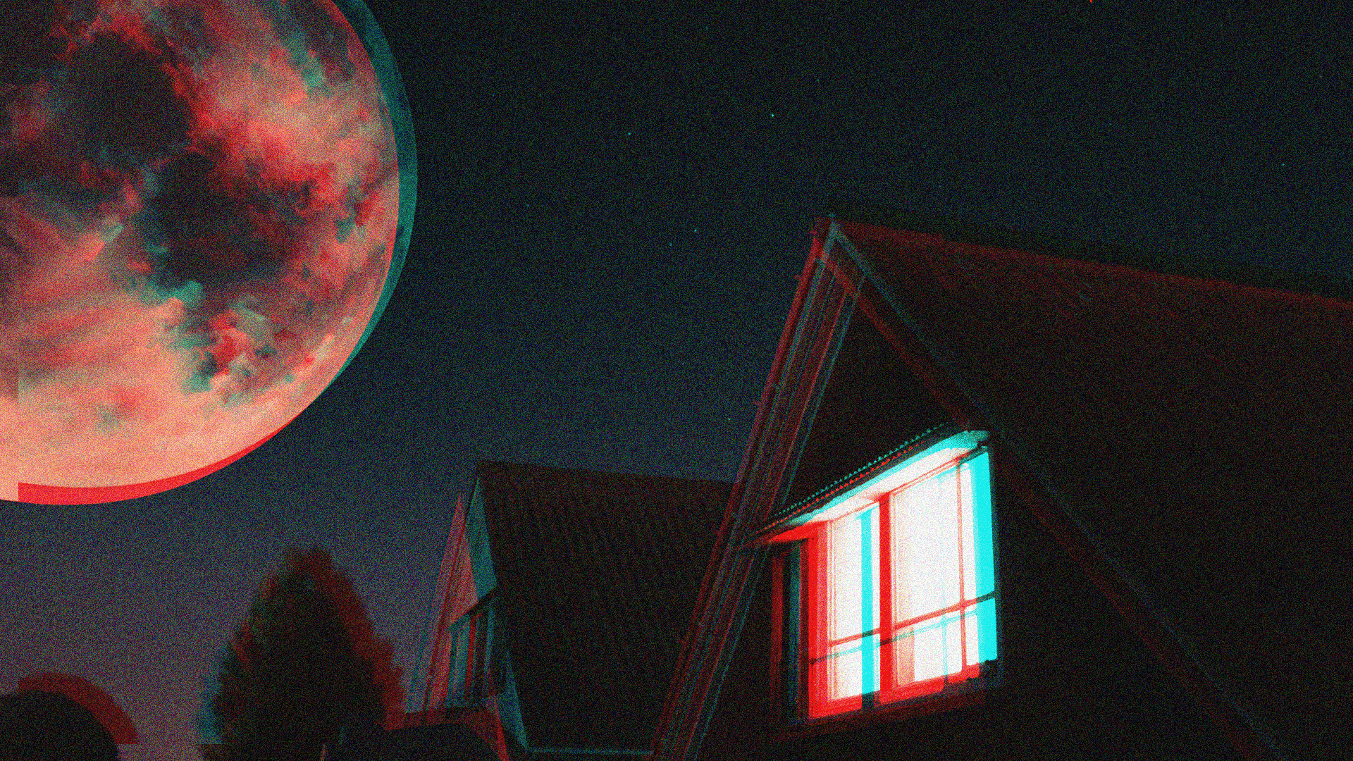 A moon above a house