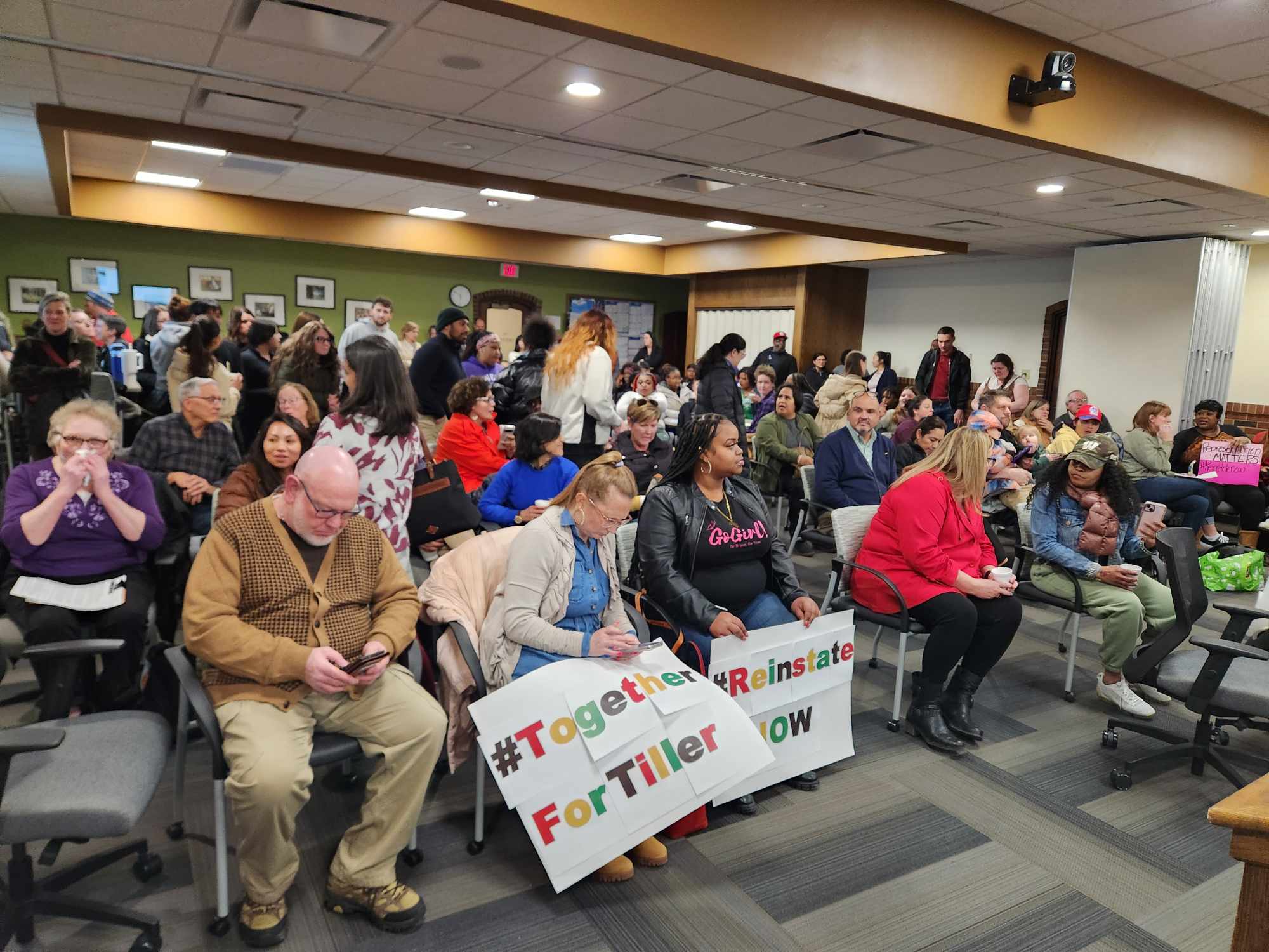 Green Bay community members attend a school board meeting