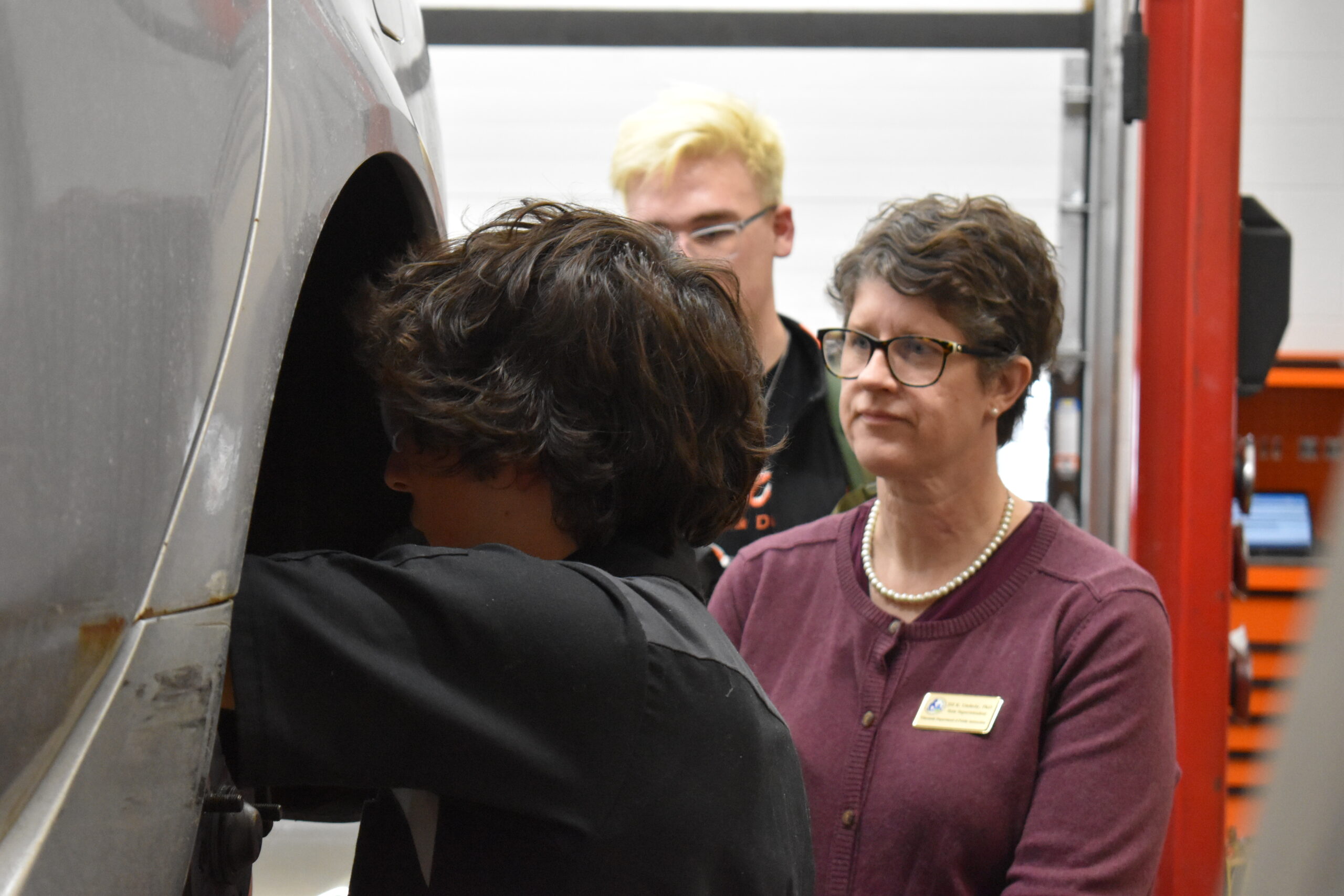 State Superintendent Jill Underly speaks with a student